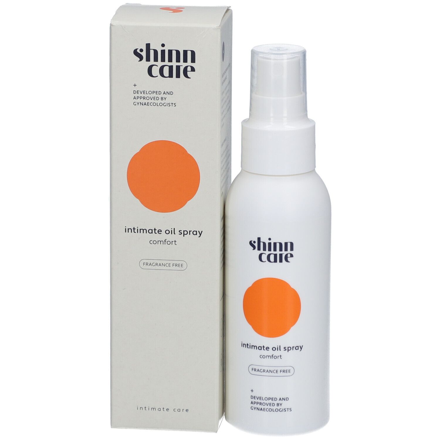 Emballage et flacon. Texte : Intimate oil spray, sans parfum. Cercle orange.