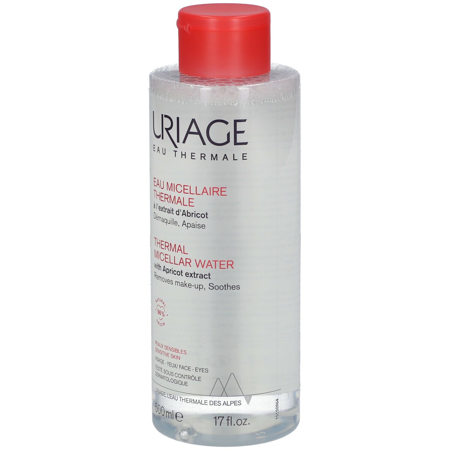 Flacon transparent, bouchon rouge. Inscription: Uriage Eau Micellaire Thermale. Extrait d'abricot. Pour peaux sensibles.