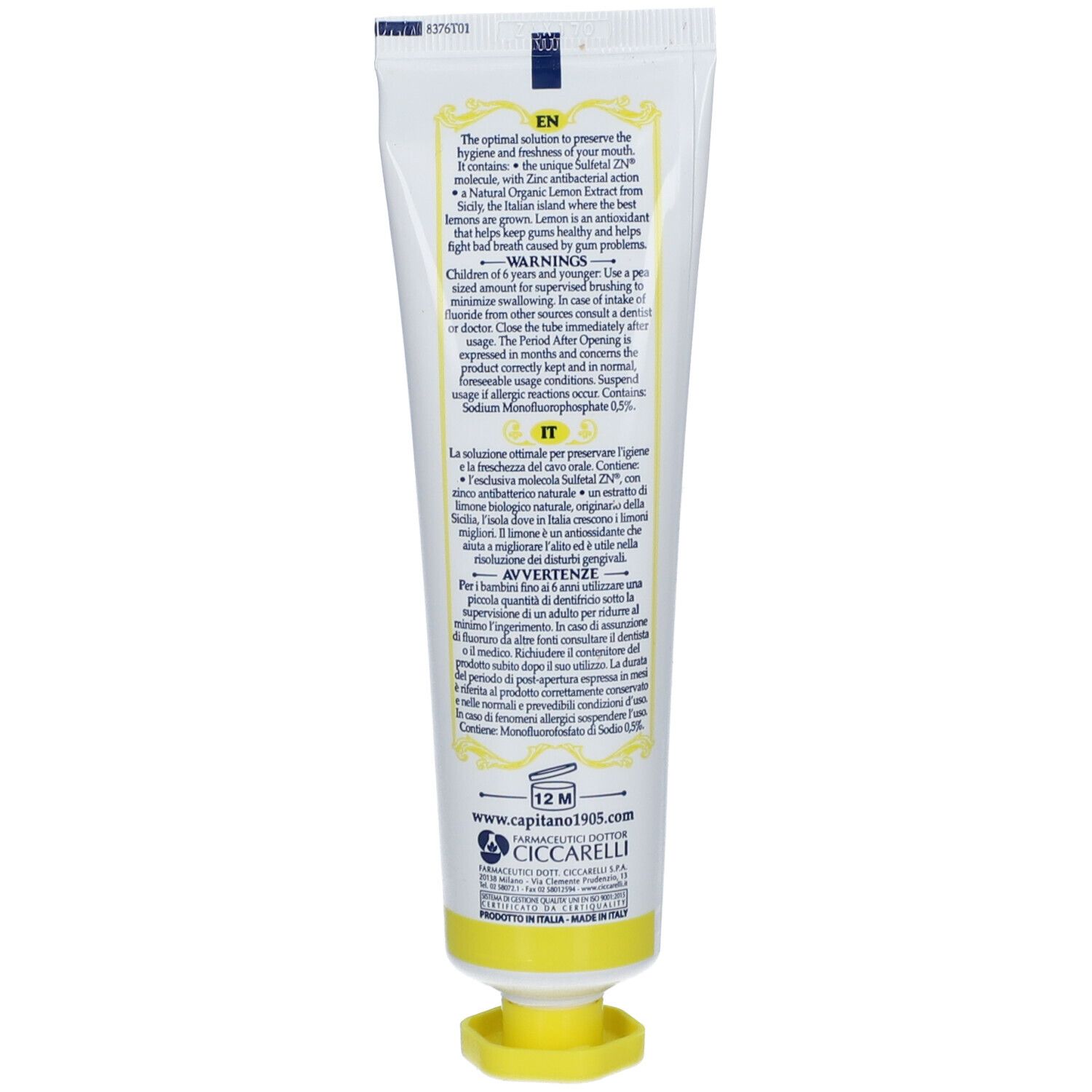 Dos du tube de dentifrice. Texte multilingue. Bouchon jaune. Fabriqué en Italie.