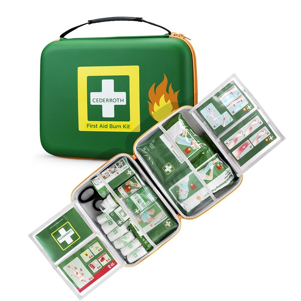 Trousse de premiers secours pour brûlures ouverte, montrant l'agencement des pansements, du gel et des ciseaux.