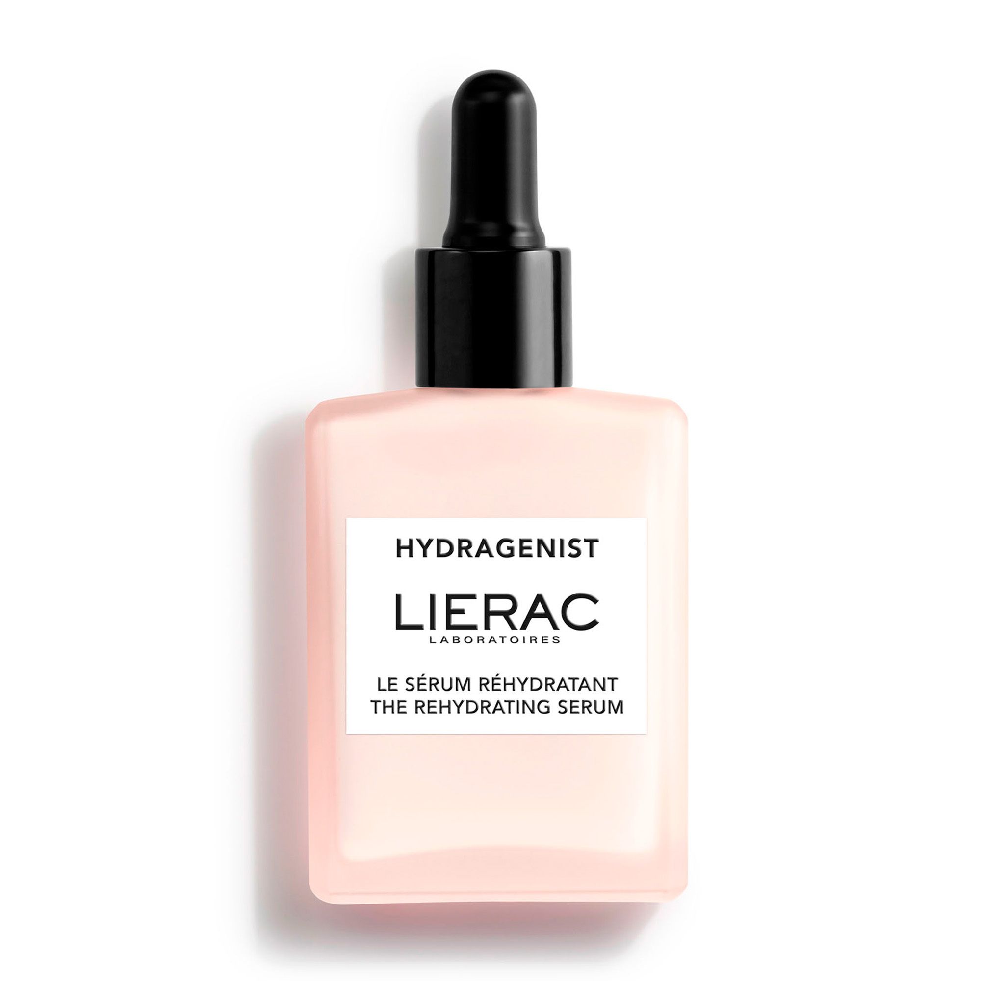 Flacon de sérum rose avec bouchon noir et pipette. Inscription : HYDRAGENIST, LIERAC. Texte : LE SÉRUM RÉHYDRATANT THE REHYDRATING SERUM.