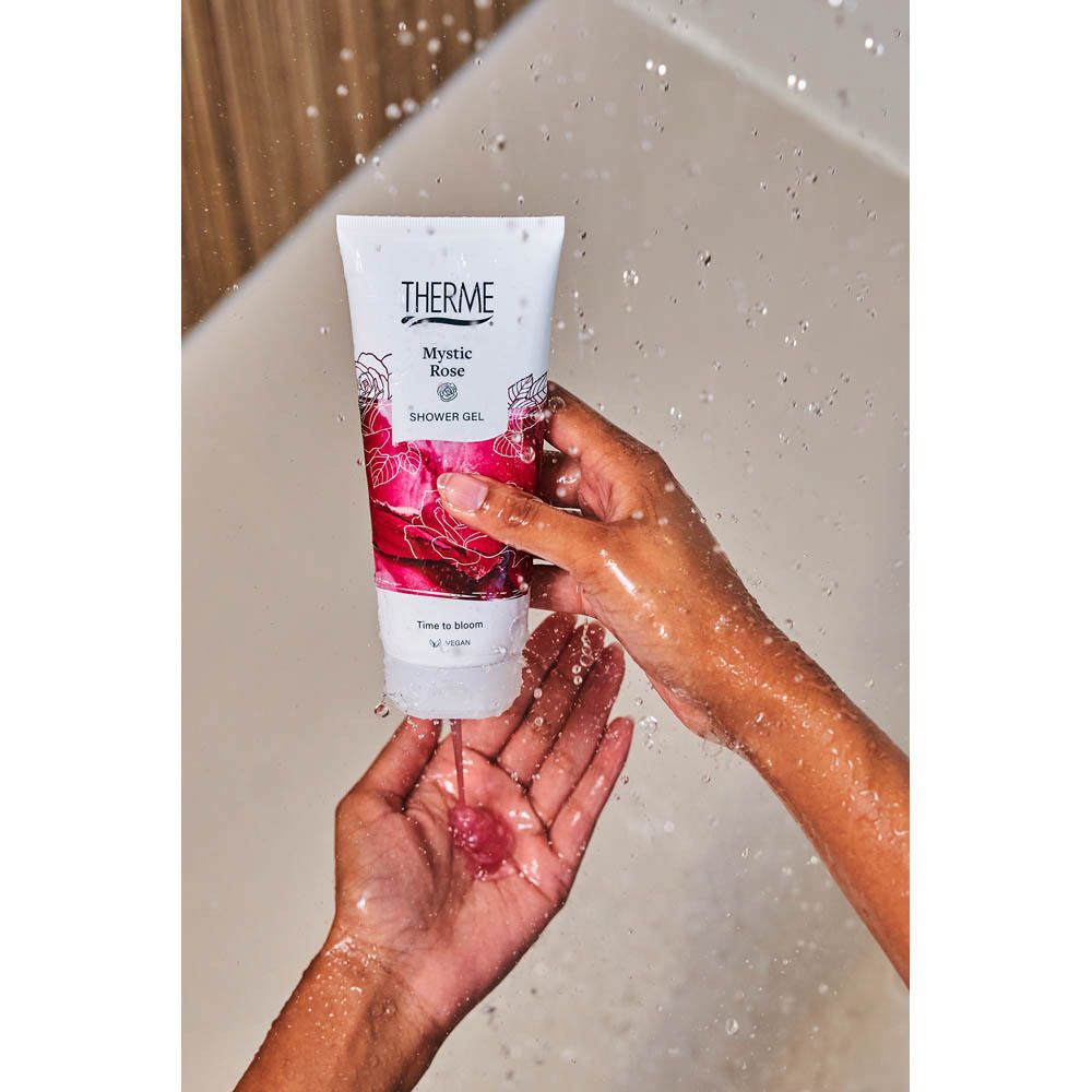 Gel douche THERME Mystic Rose dans un tube blanc avec motif de rose.