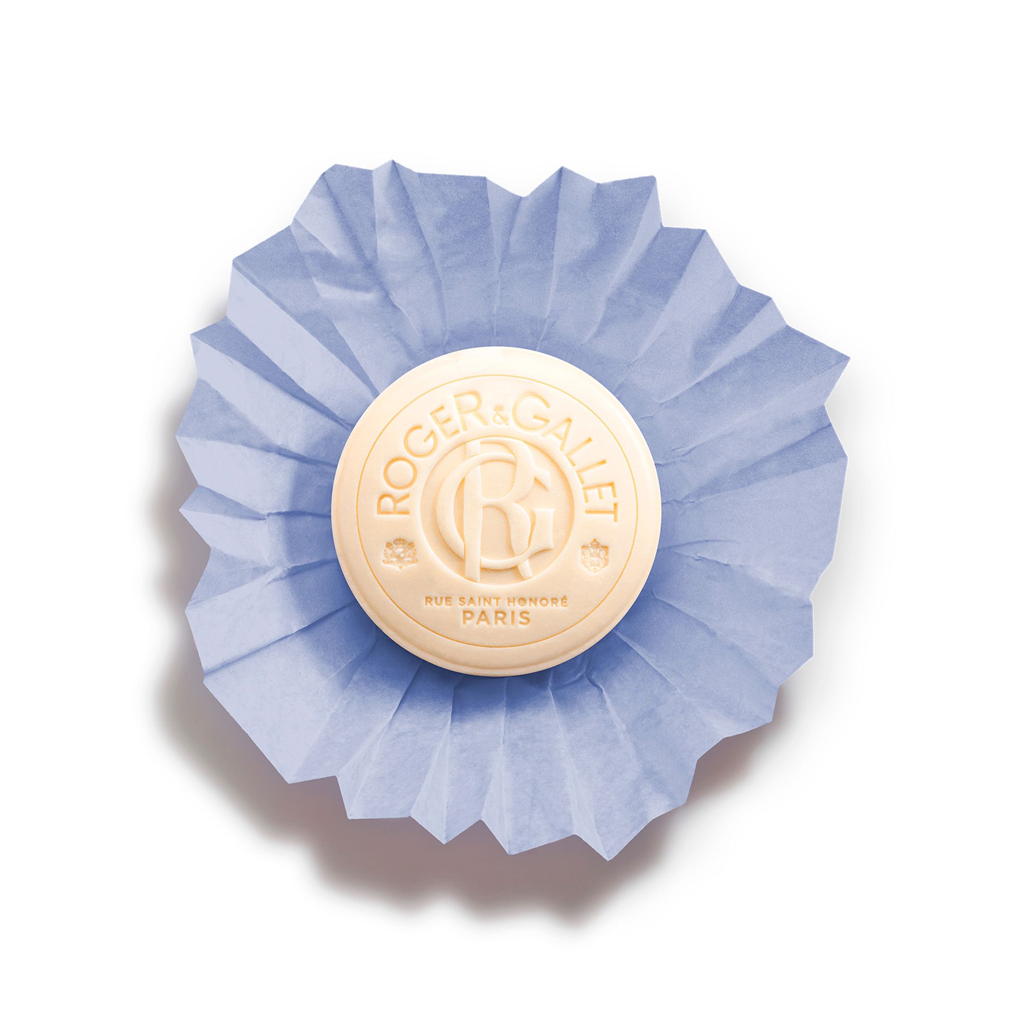 Savon dans papier bleu. Texte: Roger & Gallet, Bois de Santal. Forme ronde. Logo.