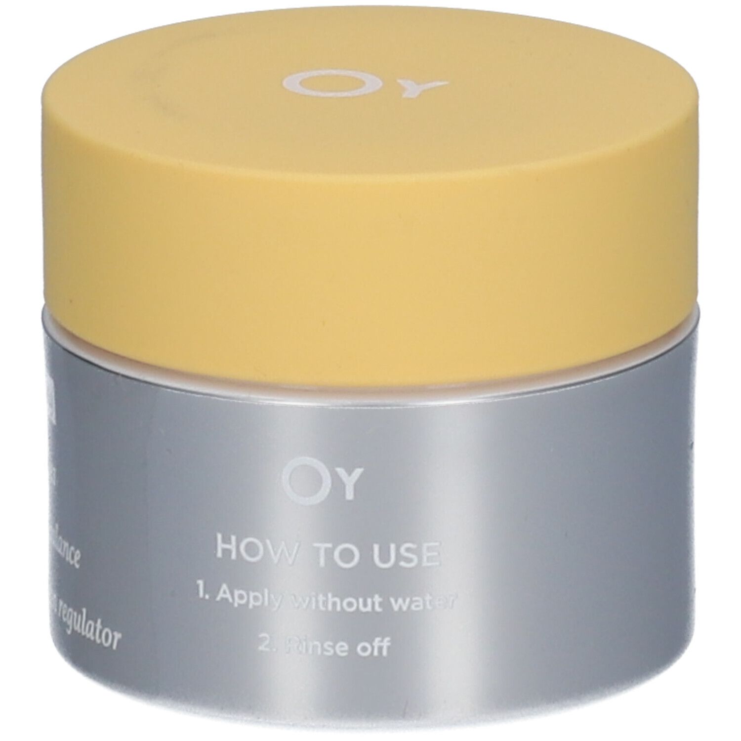Pot de crème avec couvercle jaune et contenant argenté. Logo OY et instructions d'utilisation visibles.