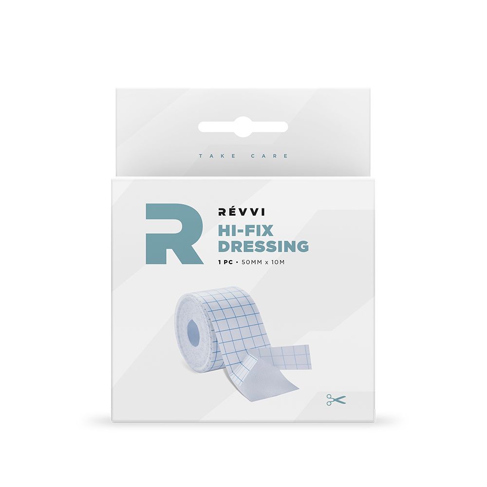 Emballage avec Hi-Fix Dressing. Visible: rouleau de ruban, 50mm x 10m, quadrillé. Texte: Révi, Hi-Fix Dressing.