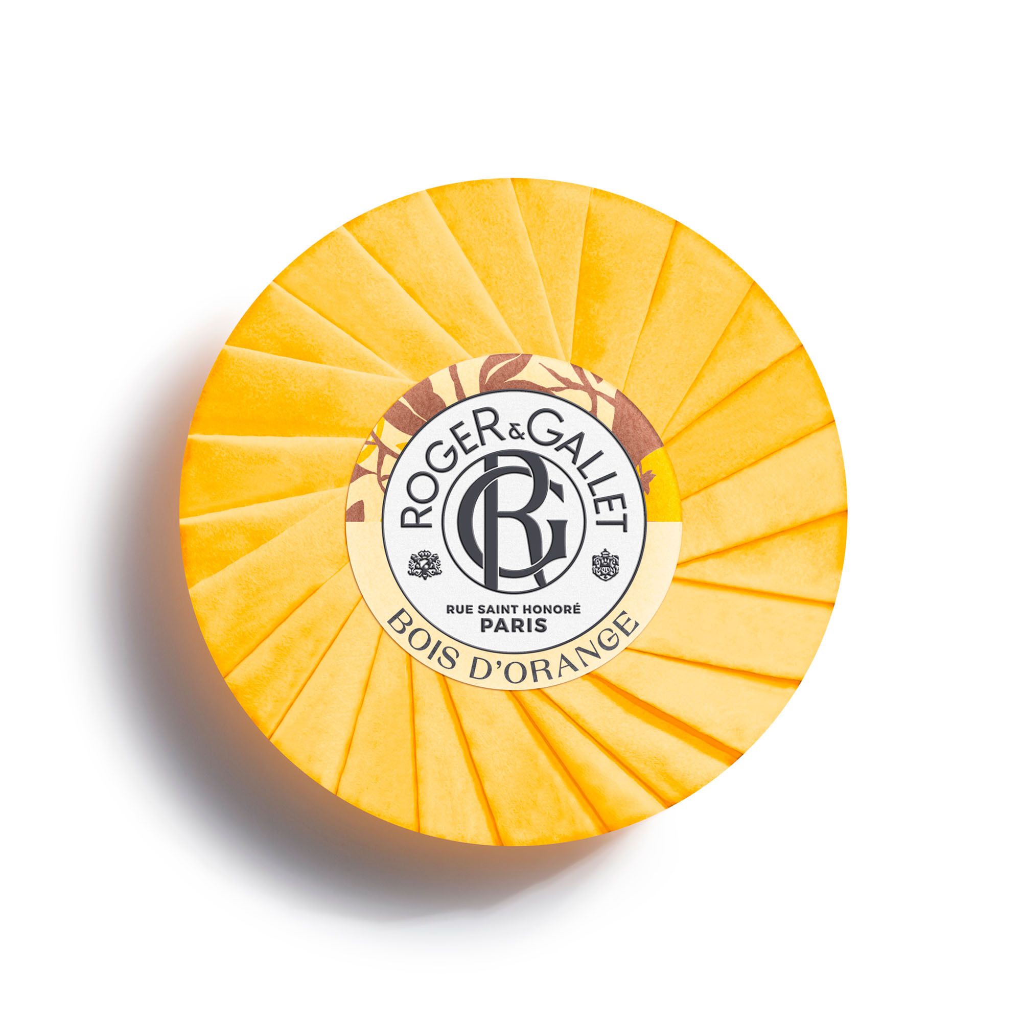 Savon rond dans papier jaune. Logo Roger & Gallet, Bois d'Orange.