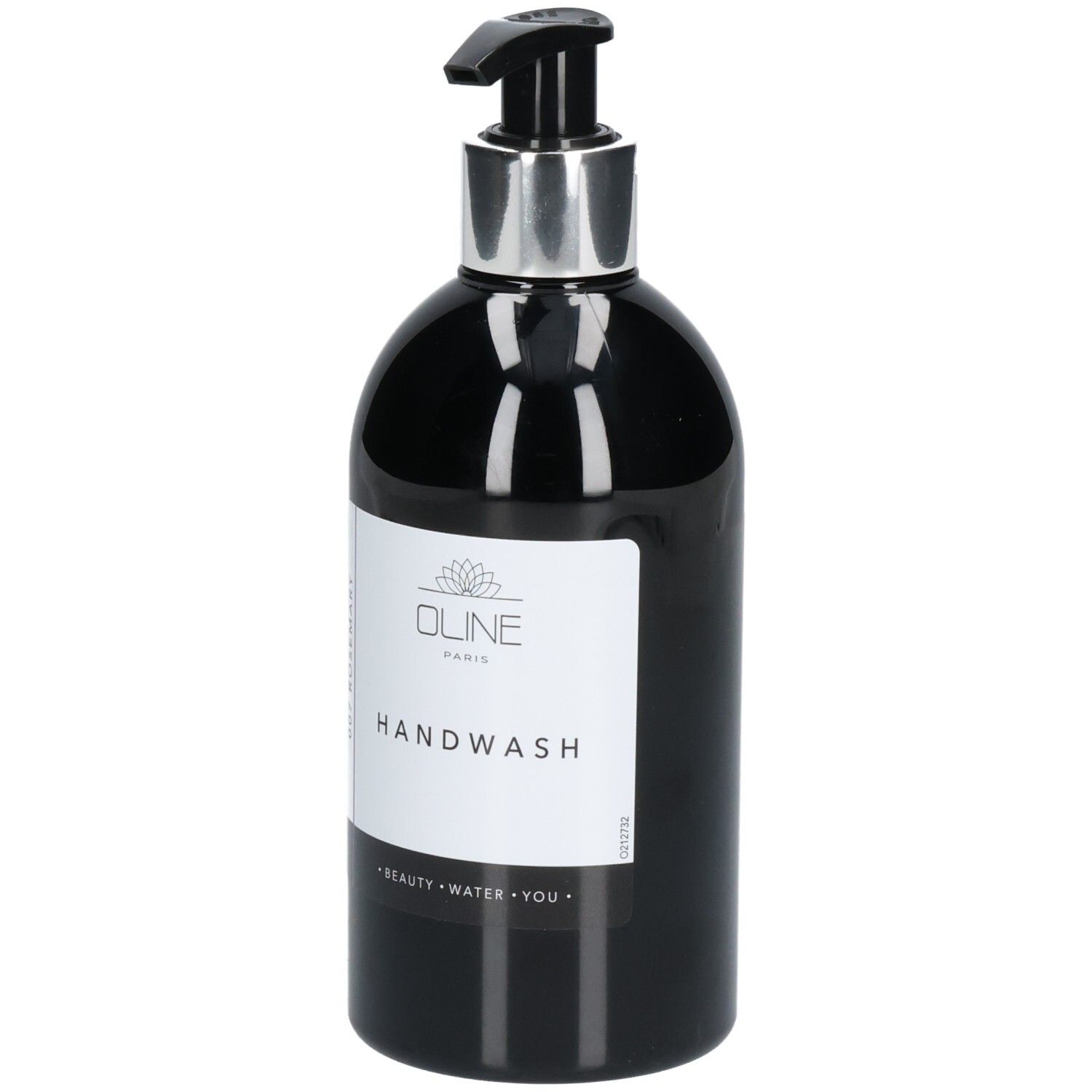 Flacon noir avec pompe argentée. Inscription: Oline Handwash. Étiquette avec texte.