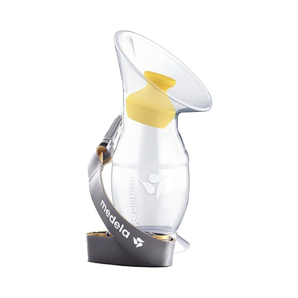 Collecteur de lait transparent avec insert jaune et sangle grise avec logo Medela. Le récipient est de forme ovale.
