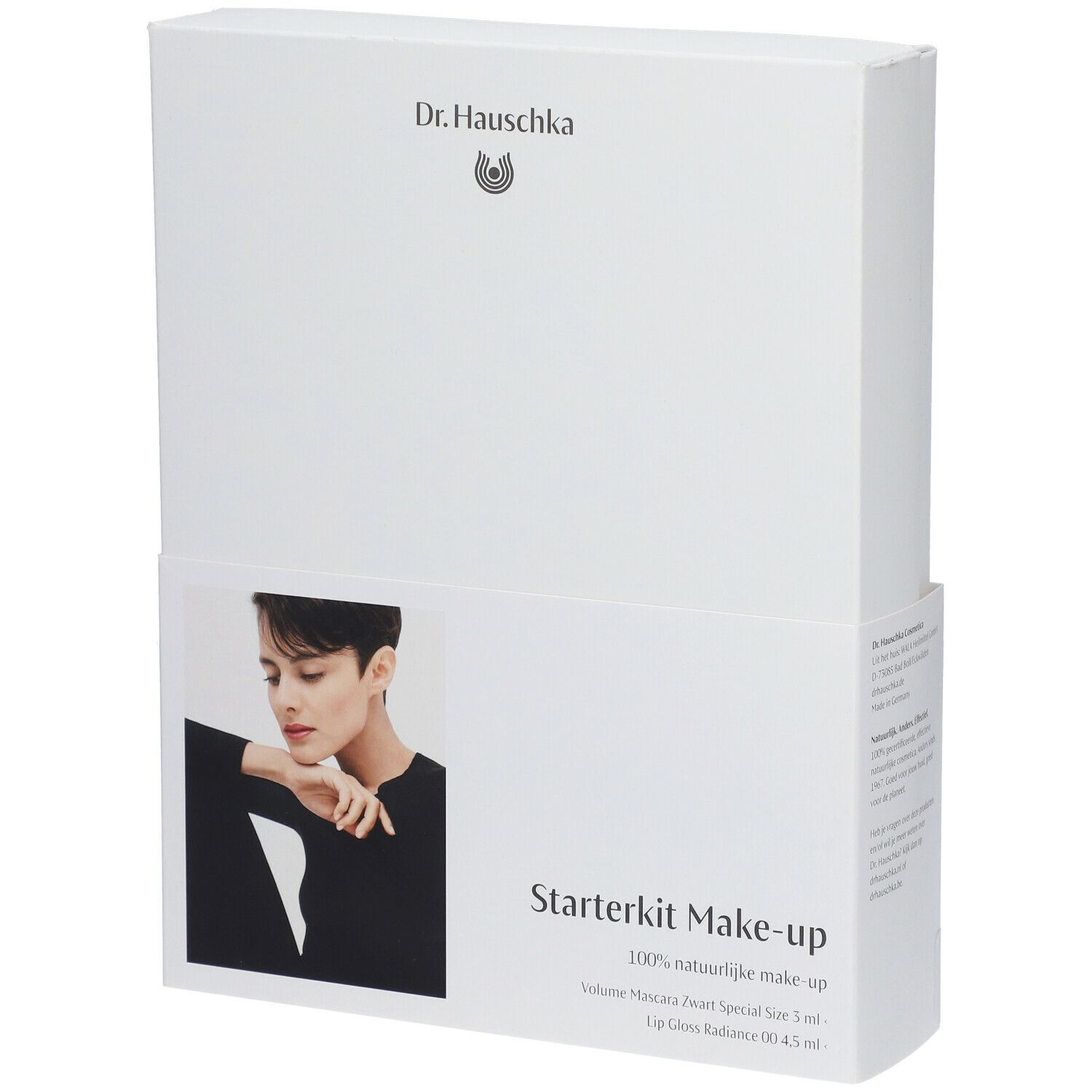 Emballage blanc avec nom du produit et modèle. Contient un kit de maquillage de démarrage. Marque : Dr. Hauschka. Texte : Volume Mascara, Lip Gloss.