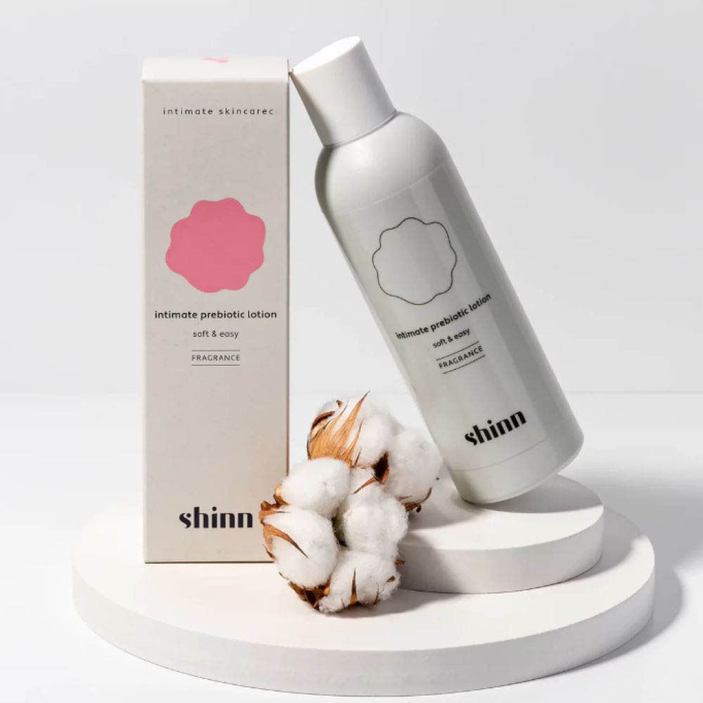 Flacon et emballage du produit. Inscription : shinn, Intimate prebiotic lotion, soft & easy, Sans parfum.
