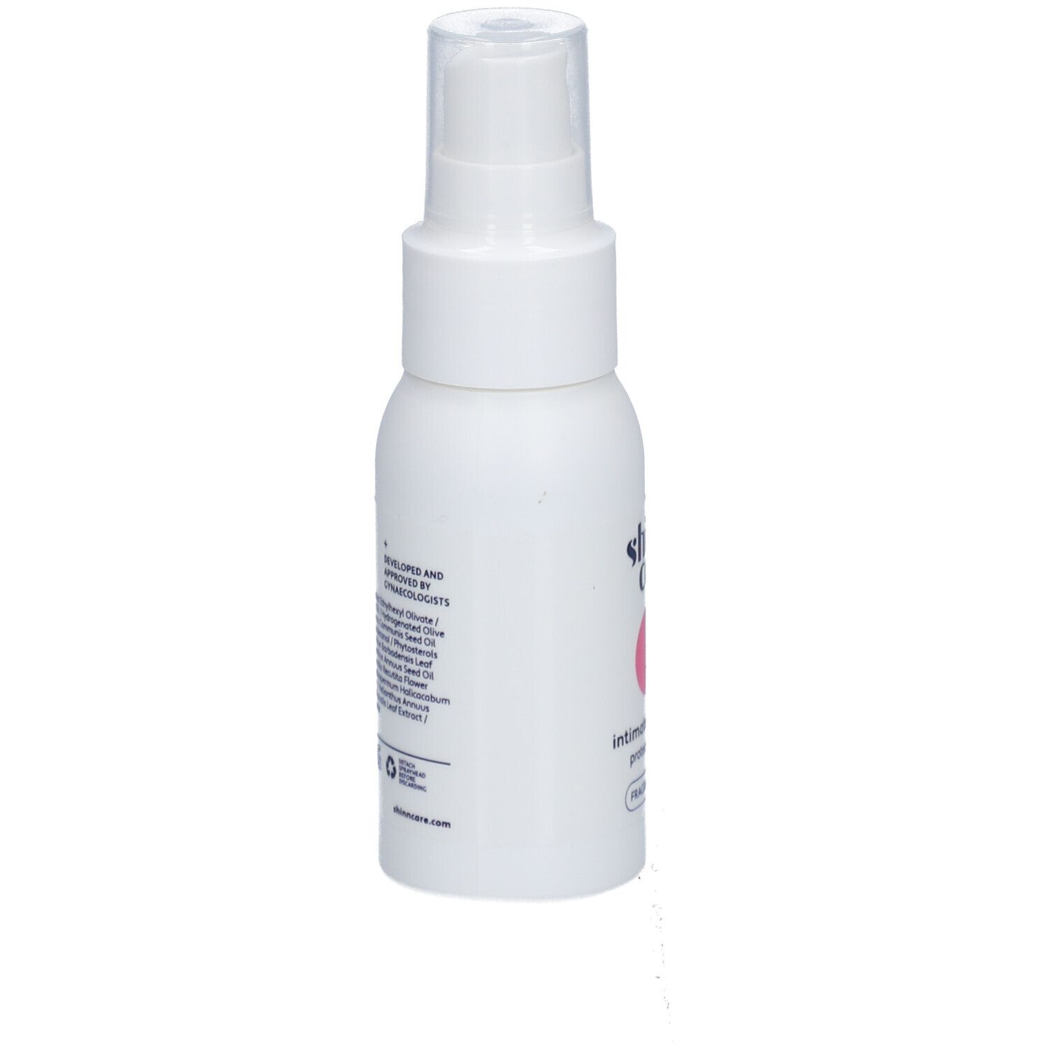 Flacon spray blanc avec texte et ingrédients. Inscription : Shinn Care, Intimate Oil Spray Protect & Repair, Sans parfum.