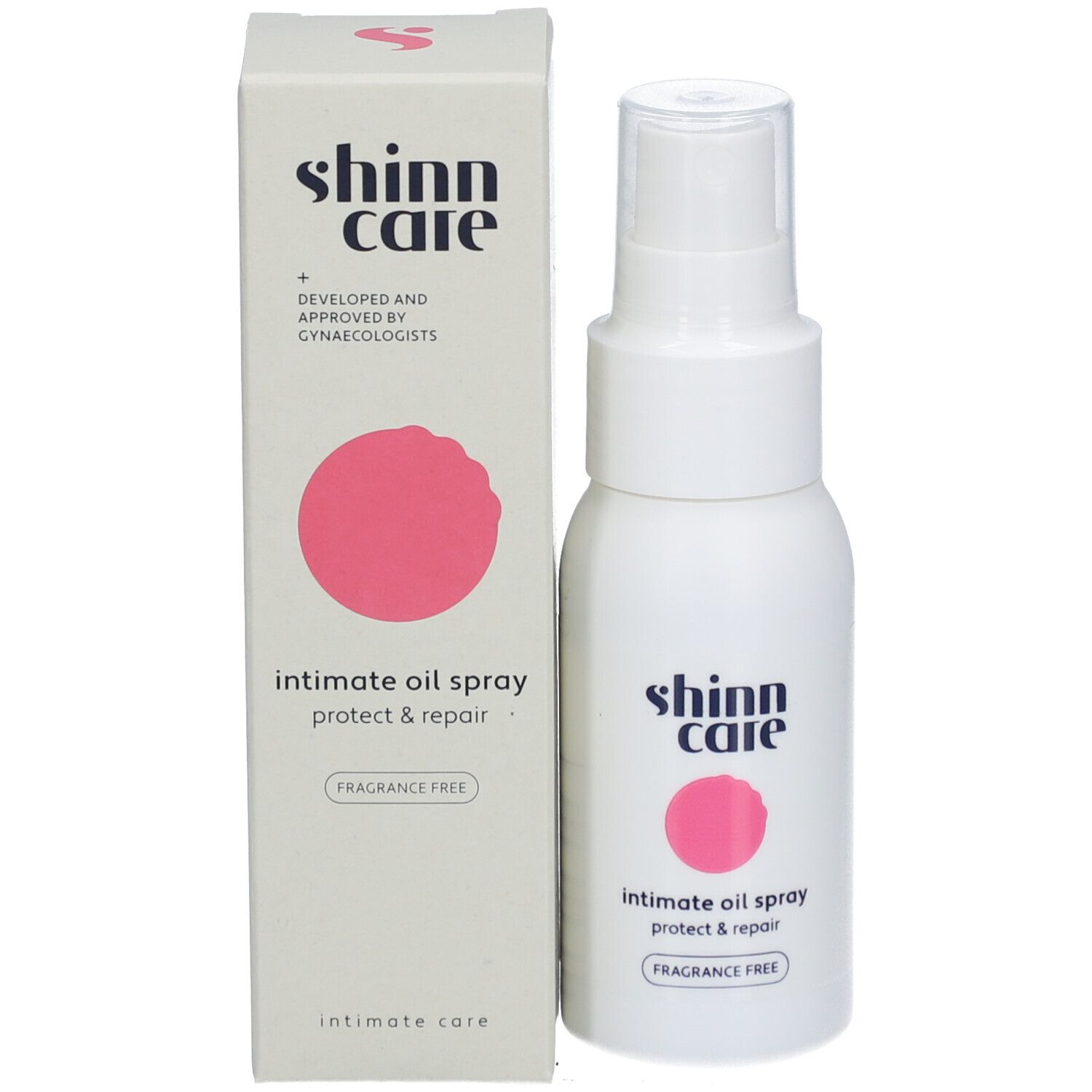 Produit et emballage. Flacon et boîte blancs avec cercle rose. Inscription : Shinn Care, Intimate Oil Spray Protect & Repair.