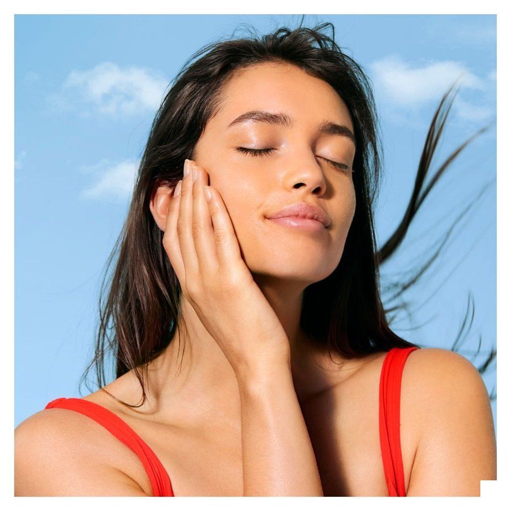 Dos du spray solaire NUXE SPF 50 avec ingrédients et certifications.