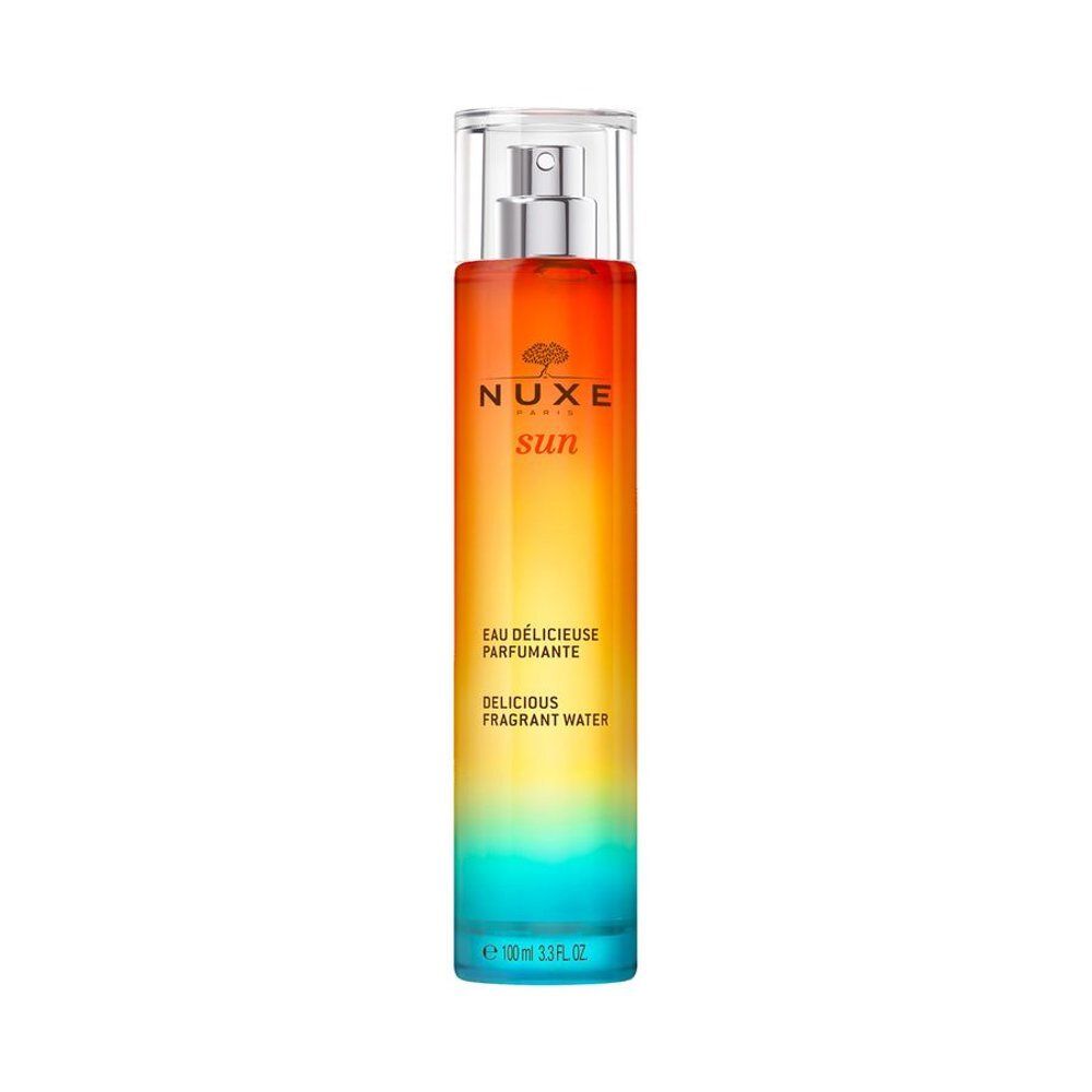 Flacon NUXE SUN Eau Délicieuse Parfumante avec vaporisateur. Dégradé de rouge, jaune à bleu.