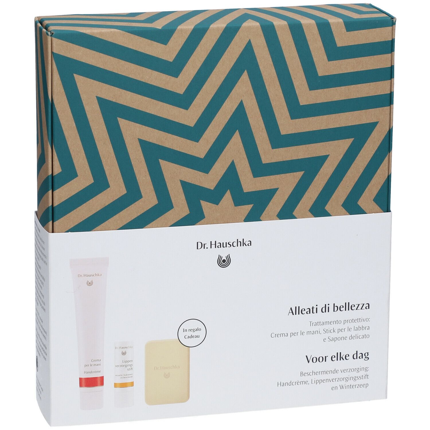 Coffret cadeau Dr. Hauschka avec crème pour les mains, stick à lèvres, savon. Emballage à motif d'étoiles.