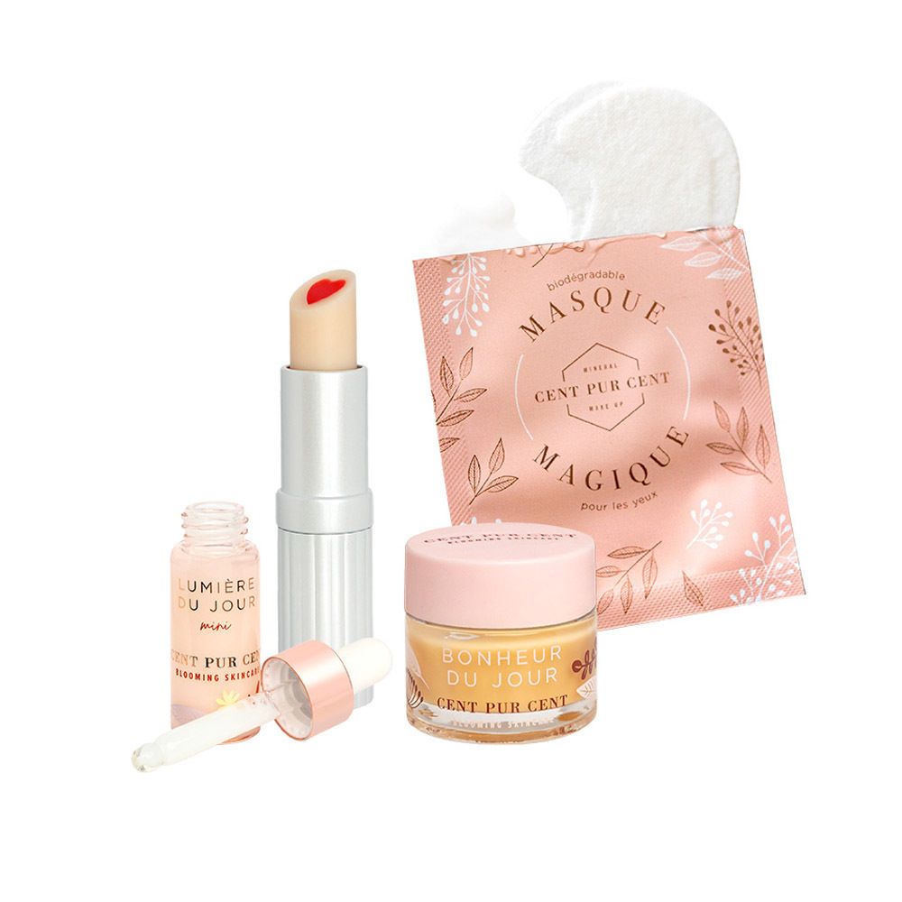 Ensemble de produits avec baume à lèvres, sérum, masque pour les yeux et crème. Tous les produits sont disposés sur fond blanc.