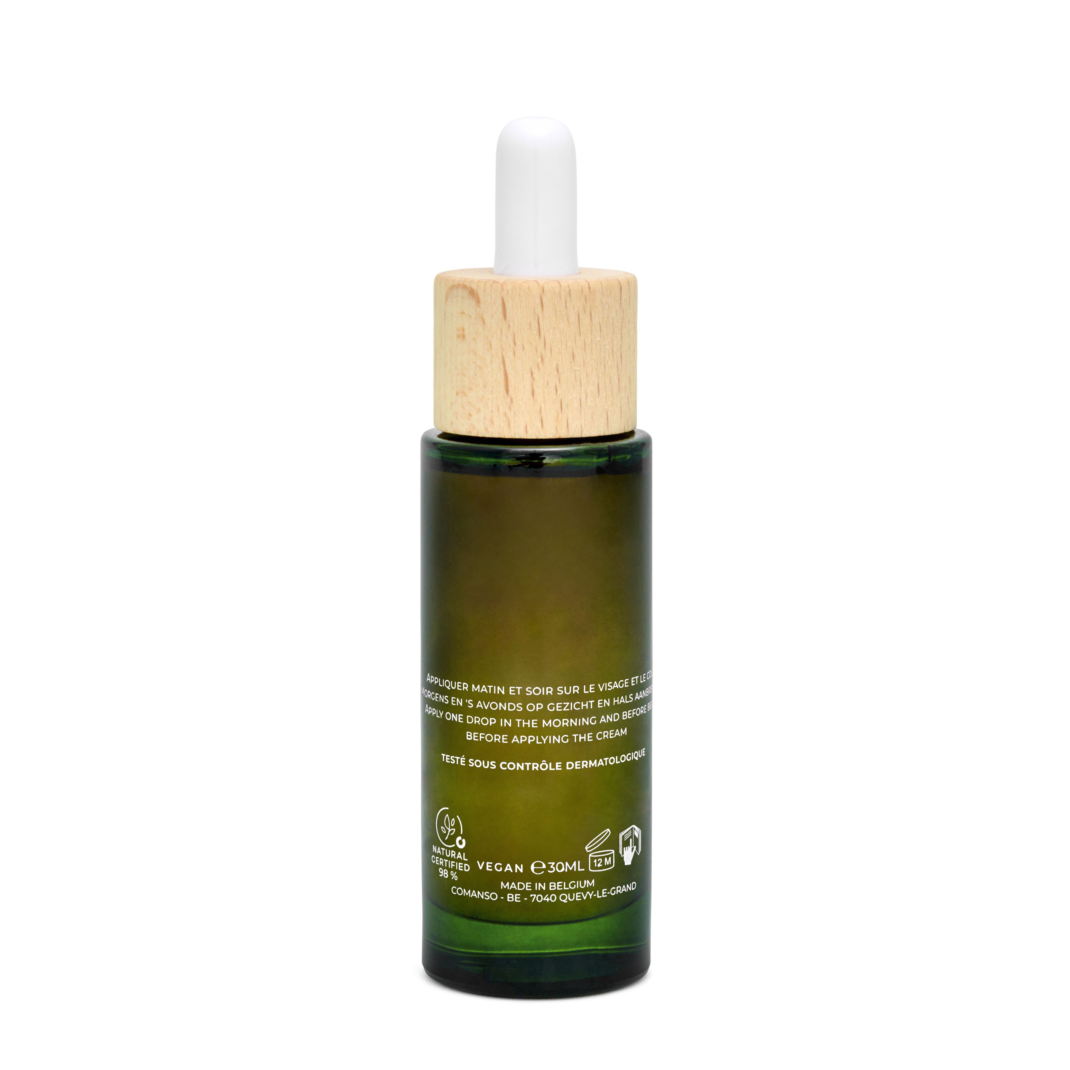 Dos du flacon en verre vert. Texte: instructions, logo Vegan, 10ml, Made in Belgium.