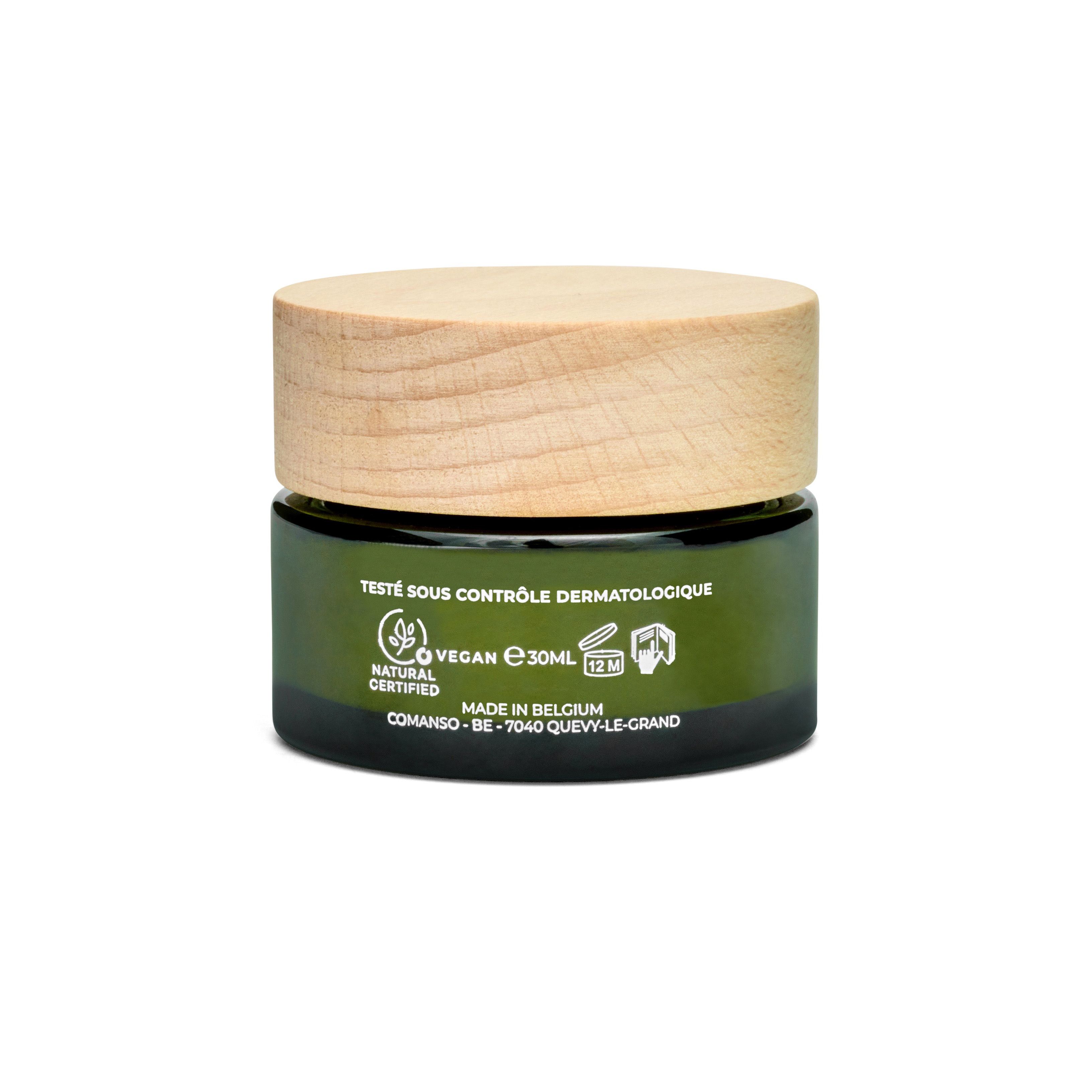 Pot de crème en verre vert avec couvercle en bois. Inscription : Vegan, 30ml, Made in Belgium. Certifications et informations.