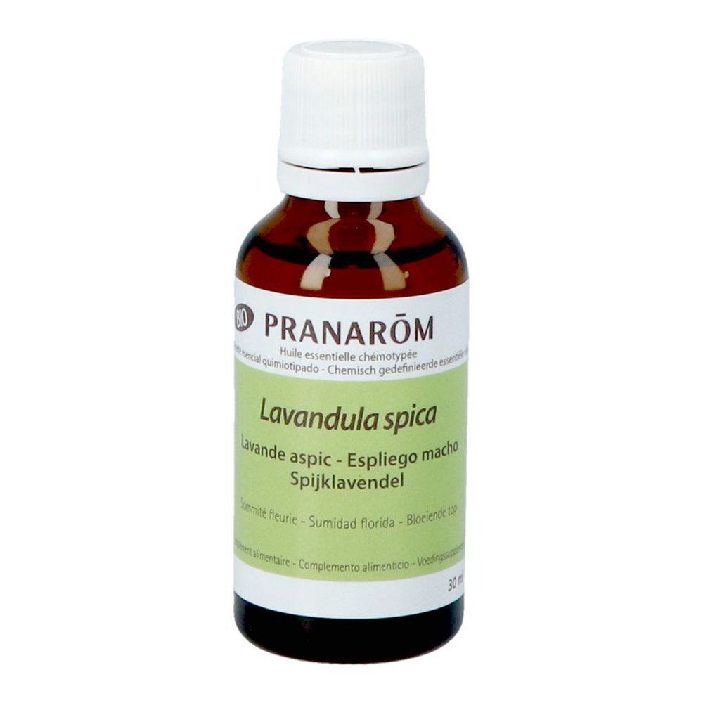 Flacon en verre brun avec bouchon blanc. Étiquette avec texte. Logo Pranarom. 30 ml.