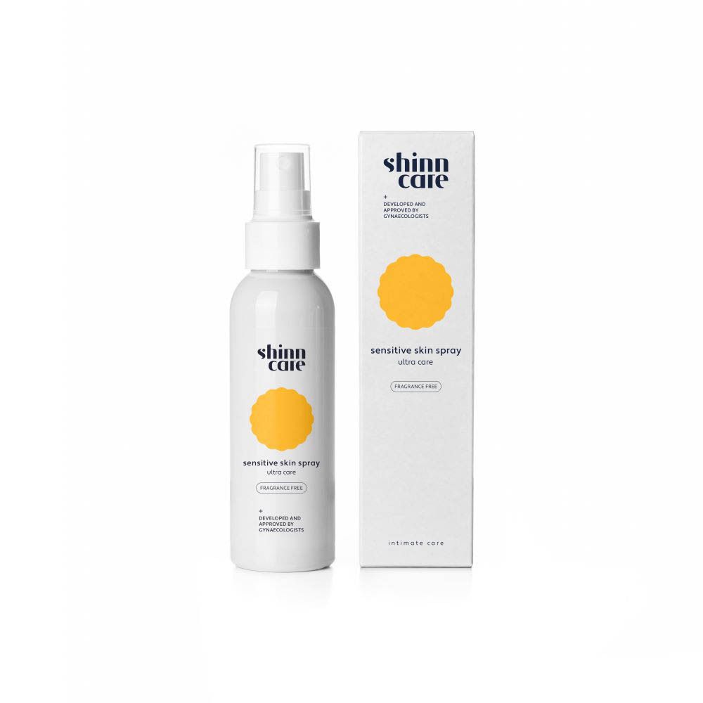 Spray blanc avec carton. Inscription : shinn care, sensitive skin spray, ultra care, sans parfum.