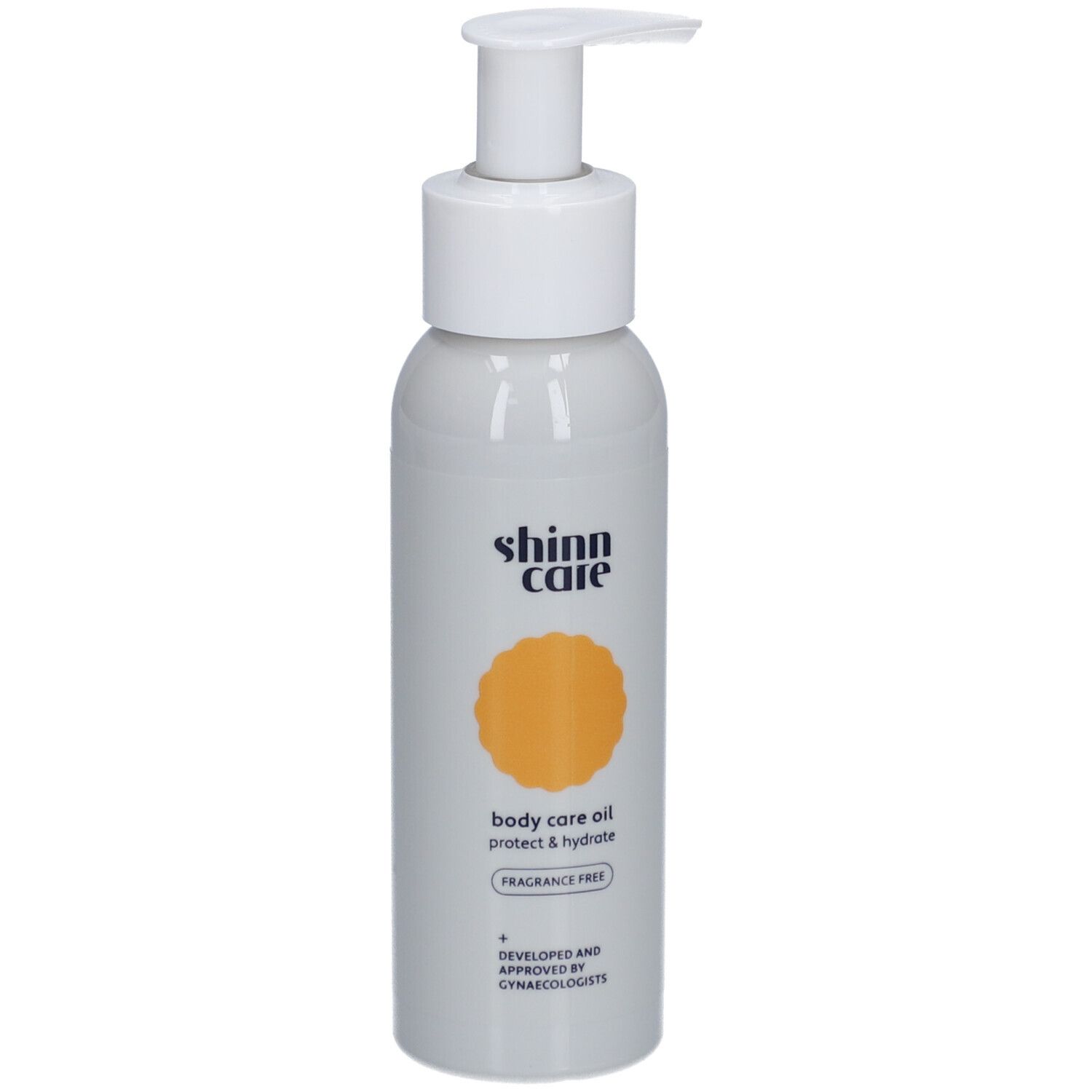 Flacon gris avec pompe blanche. Inscription : shinn care, body care oil, protect & hydrate, sans parfum.