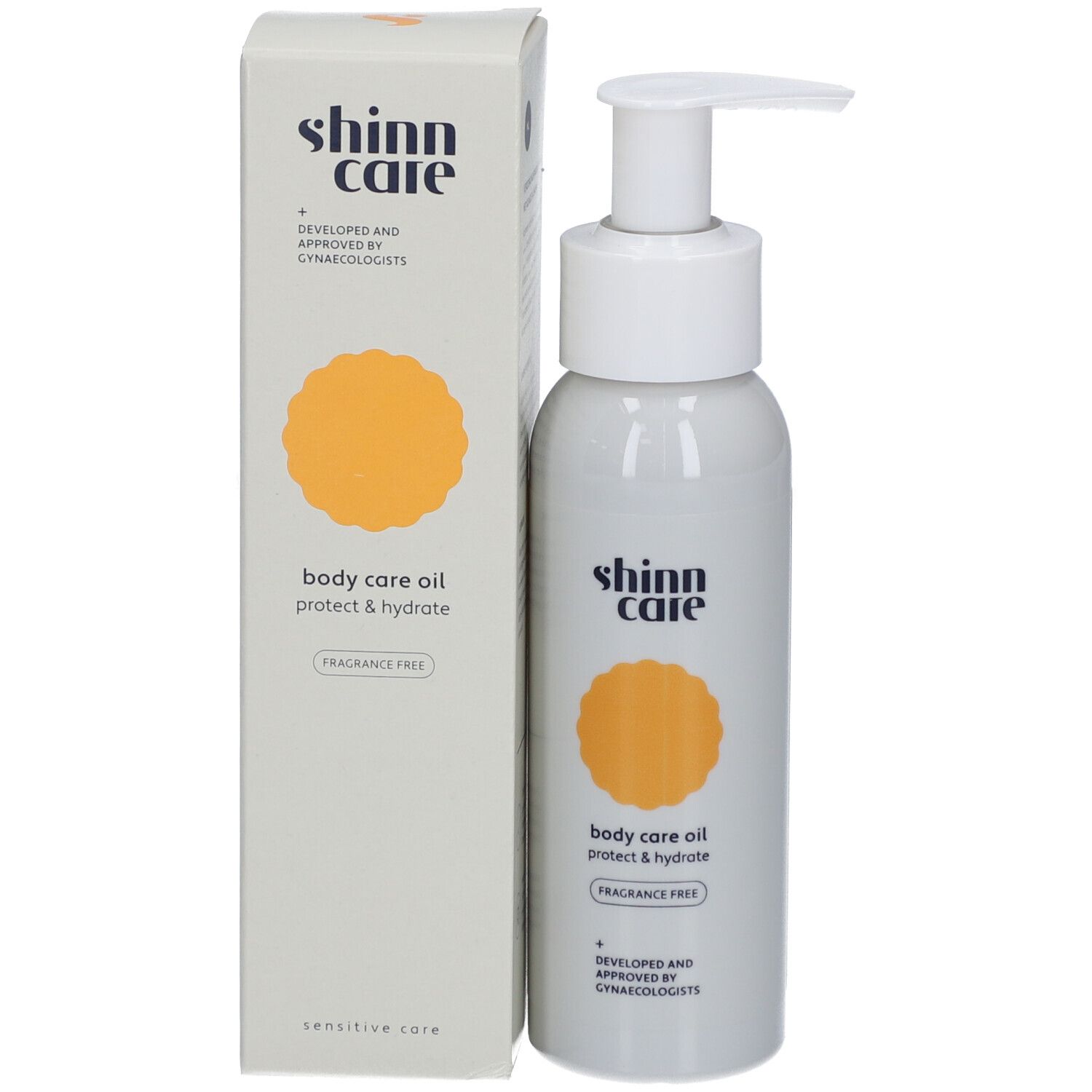 Flacon gris avec pompe blanche et carton. Inscription : shinn care, body care oil, protect & hydrate, sans parfum.