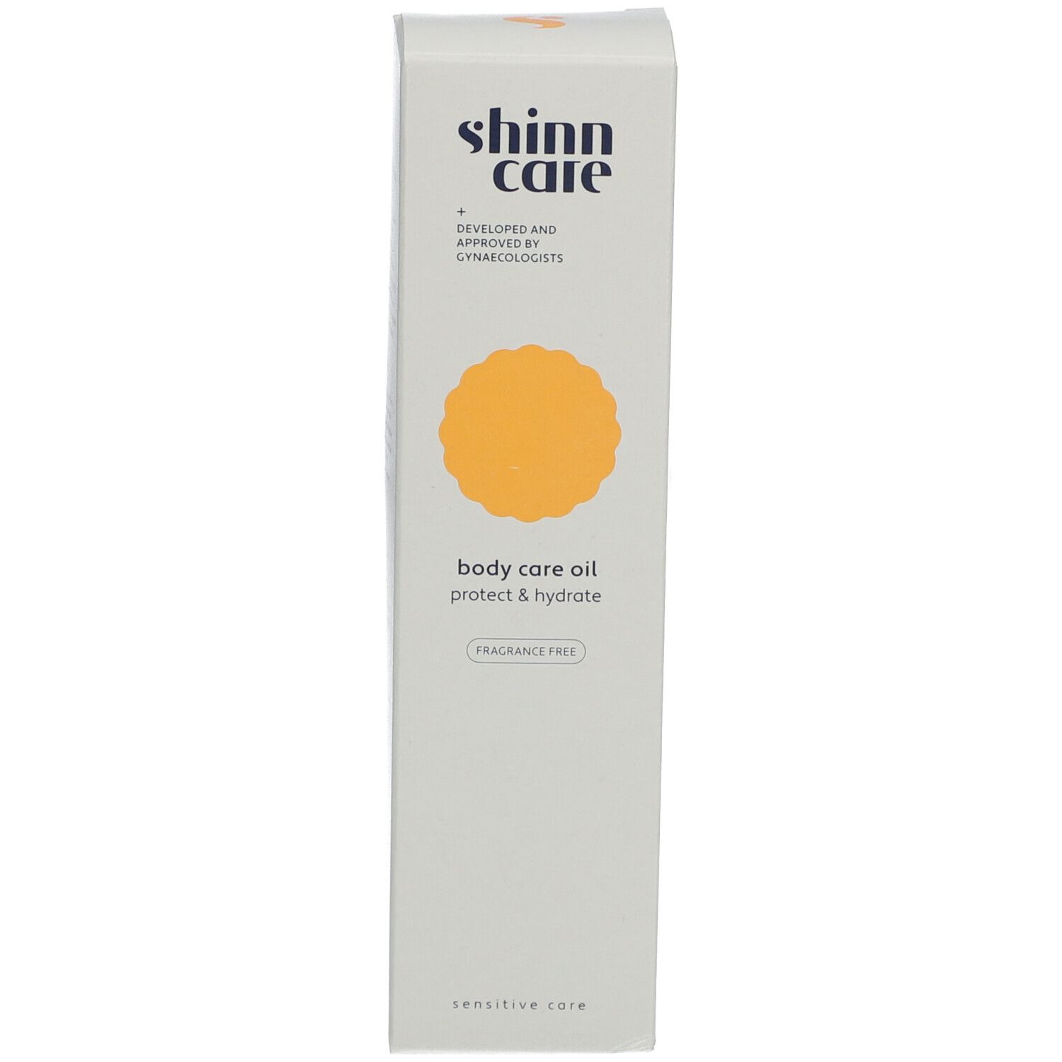 Boîte haute et étroite. Inscription : shinn care, body care oil, protect & hydrate, sans parfum.