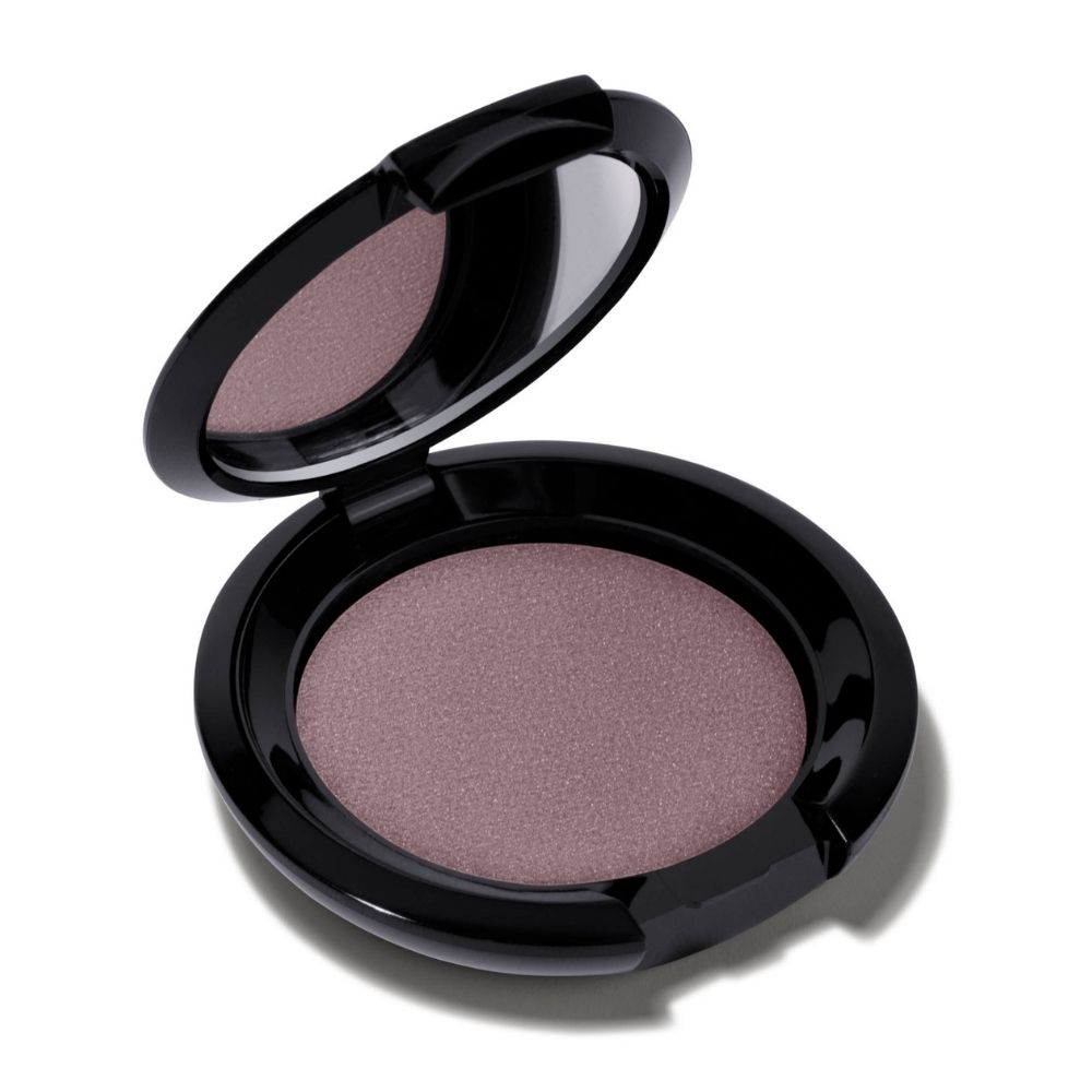 Boîtier d'ombre à paupières noir rond, couvercle ouvert. Intérieur: fard taupe rosé. Miroir dans le couvercle.
