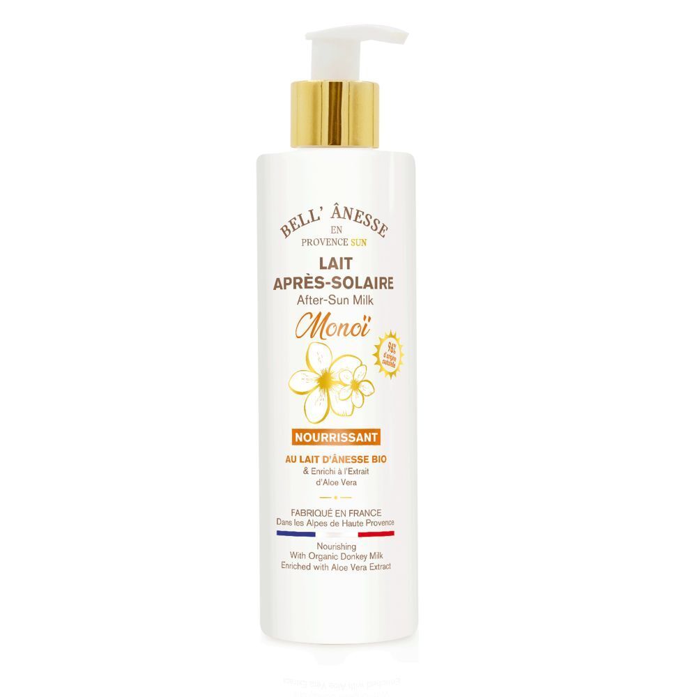 Flacon blanc avec pompe dorée. Inscription: Bell' Ânesse Lait Après-Solaire Monoï. Au lait d'ânesse bio et aloe vera.