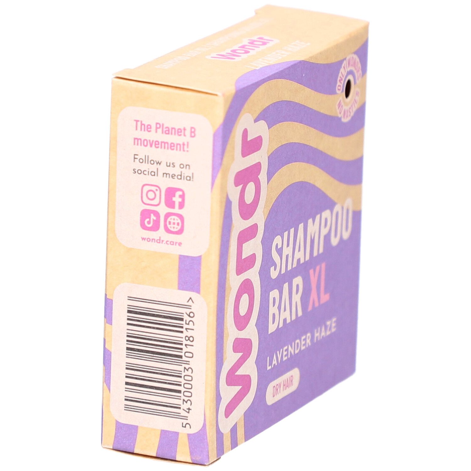Boîte en carton, vue latérale. Motifs vagues violettes et jaunes. Texte: Shampoo Bar XL, Lavender Haze. Marque: Wondr. Code-barres.