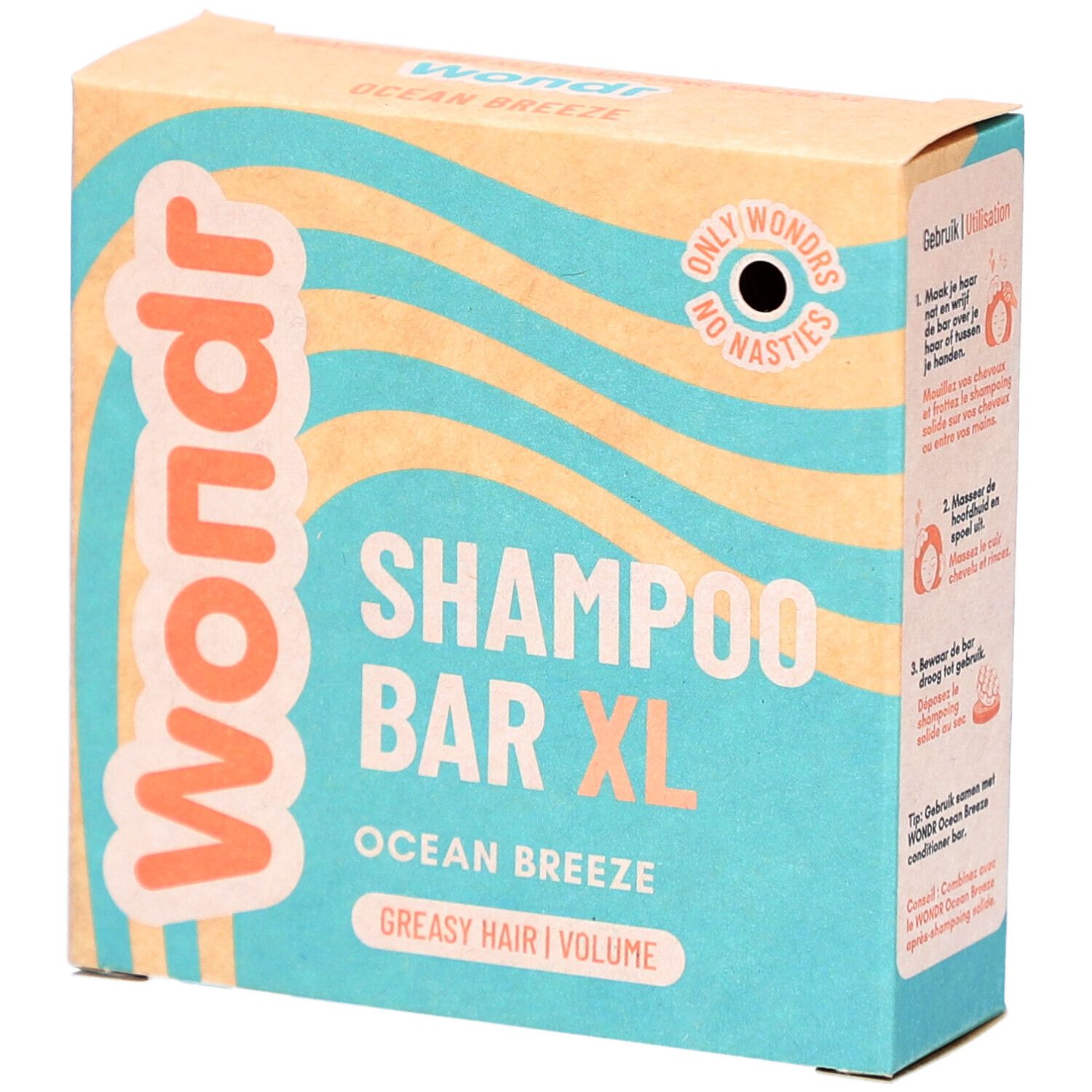 Boîte en carton. Inscription: Wondr, Shampoo Bar XL, Ocean Breeze, cheveux gras. Motif vagues.