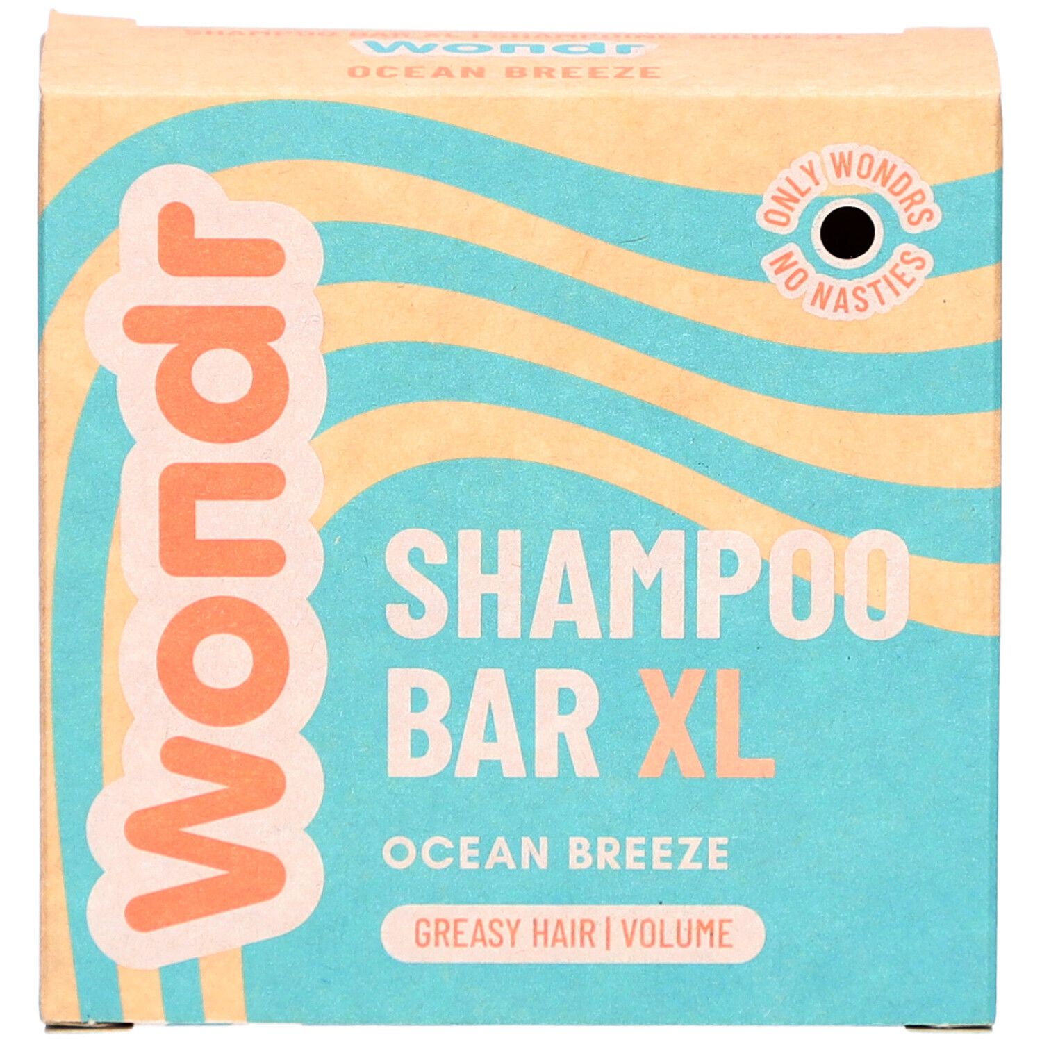 Boîte en carton. Inscription: Wondr, Shampoo Bar XL, Ocean Breeze, cheveux gras. Motif vagues.