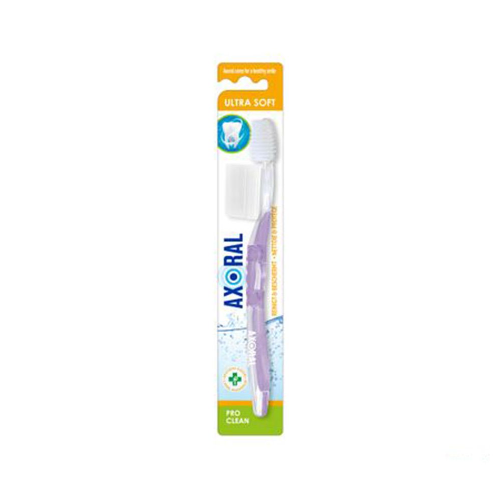 Brosse à dents avec capuchon de protection. Manche violet, tête blanche. Inscriptions "Ultra Soft" et "Axoral".