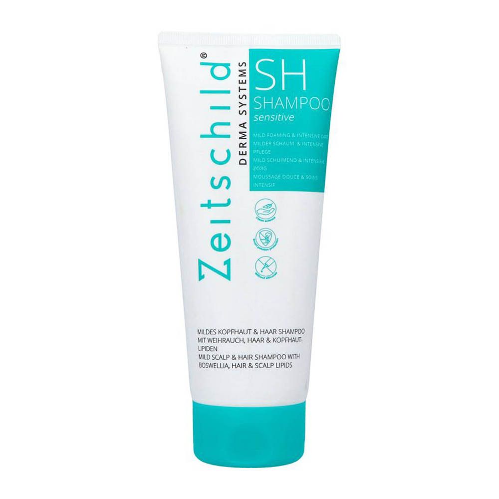 Tube blanc avec bouchon bleu. Inscription : Zeitschild Derma Systems SH Shampoo sensitive. Produit pour cuir chevelu sensible.