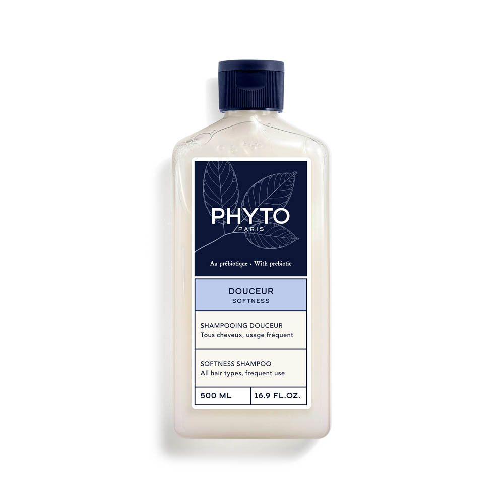 Flacon blanc avec bouchon bleu. Étiquette "Phyto Paris" et "Douceur". Textes français et anglais. Contenance 600 ml.