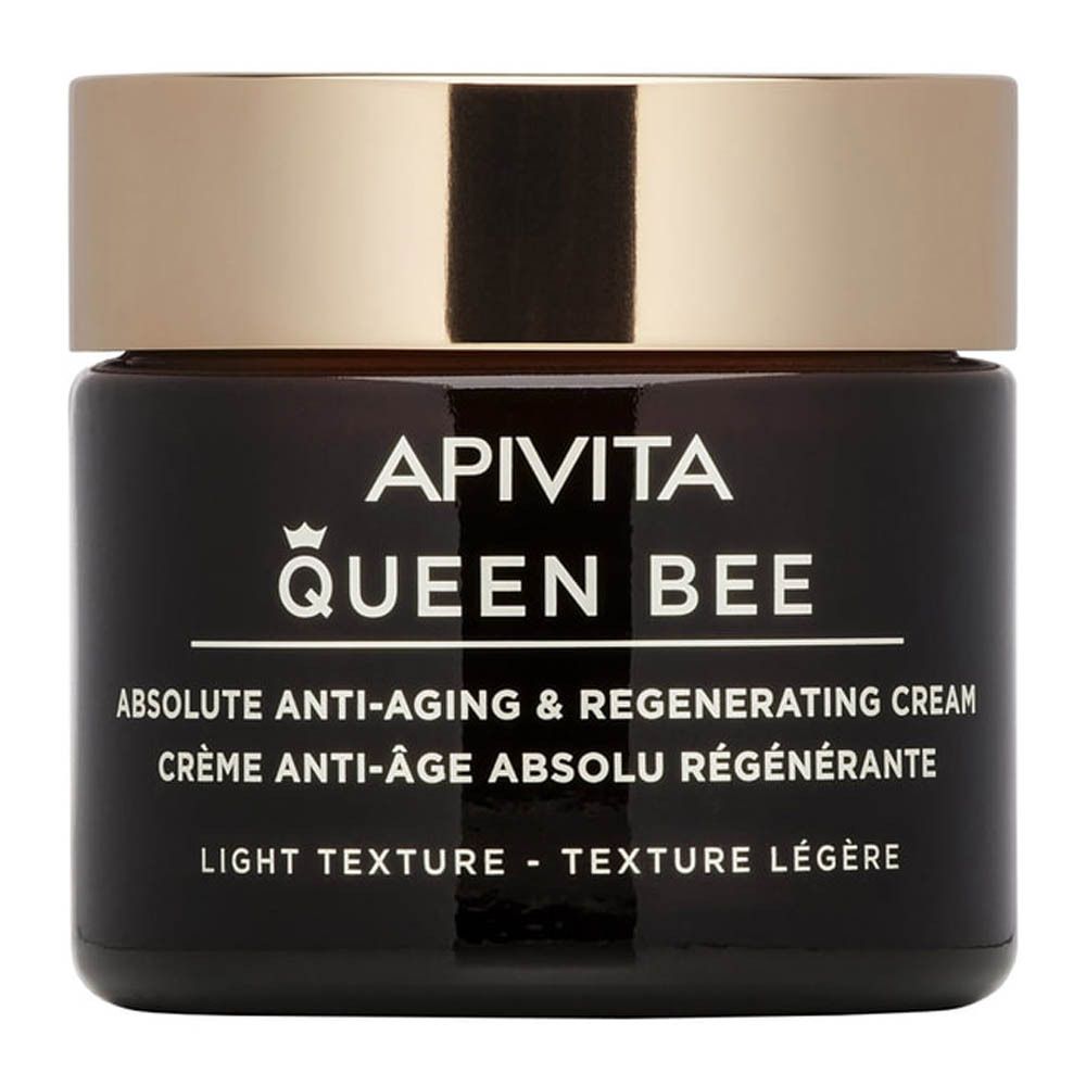 Pot de crème foncé avec couvercle doré. Inscription : Apivita Queen Bee, crème anti-âge, texture légère.