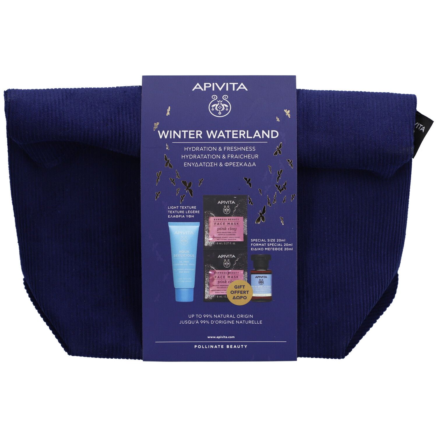Trousse de toilette bleu foncé avec emballage de produits. Sur l'emballage : Apivita Winter Waterland, masques faciaux, sérum.