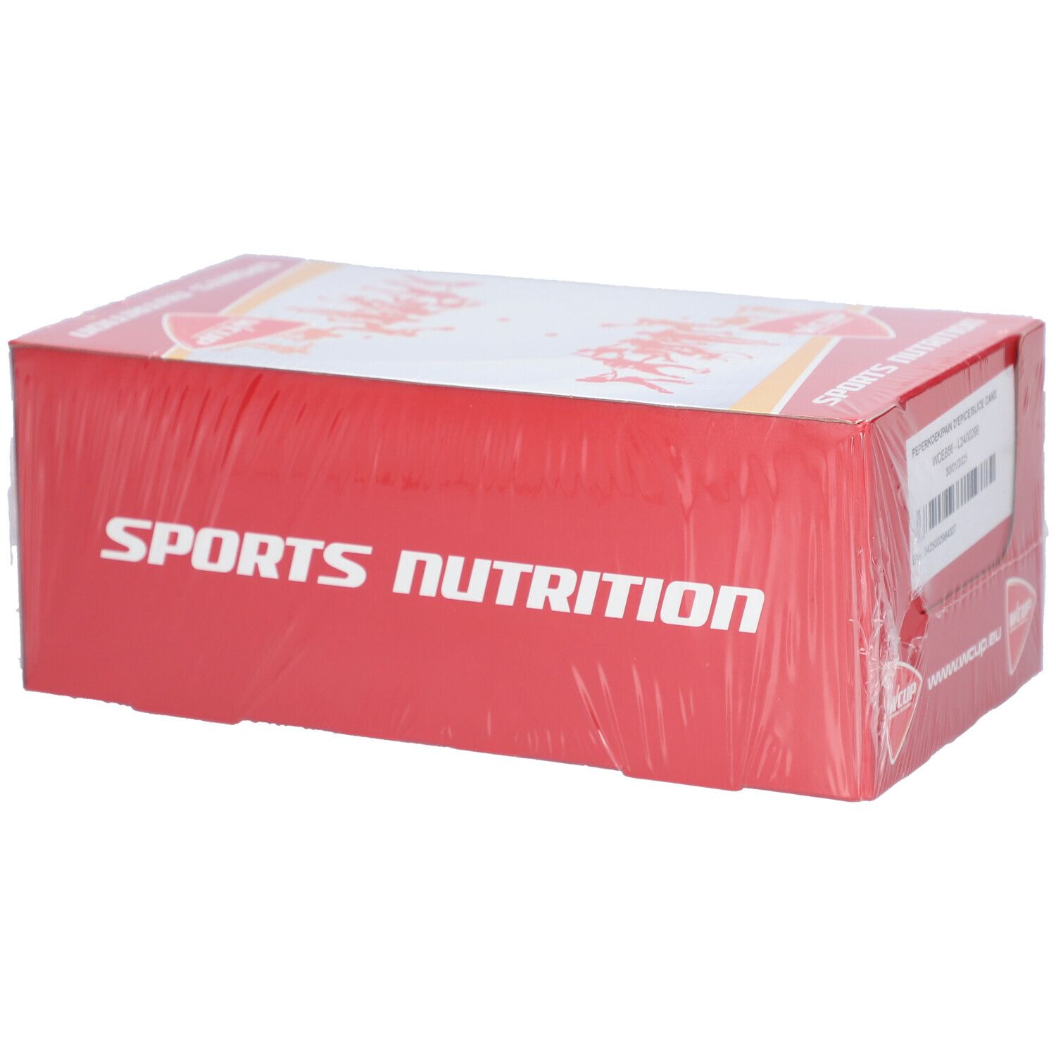 Emballage rouge avec l'inscription "SPORTS NUTRITION". L'emballage est scellé dans du film plastique.