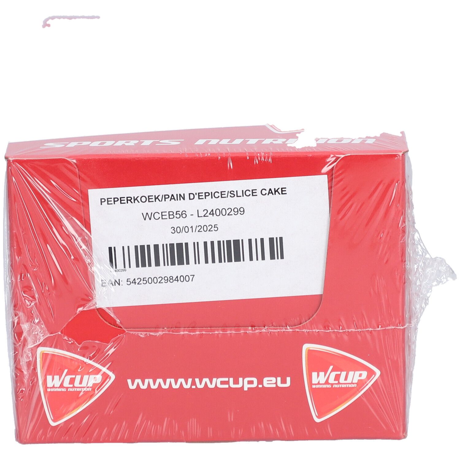Emballage rouge avec l'inscription "SPORTS NUTRITION". L'emballage porte la mention "PEPERKOEK/PAIN D'EPICE/SLICE CAKE".
