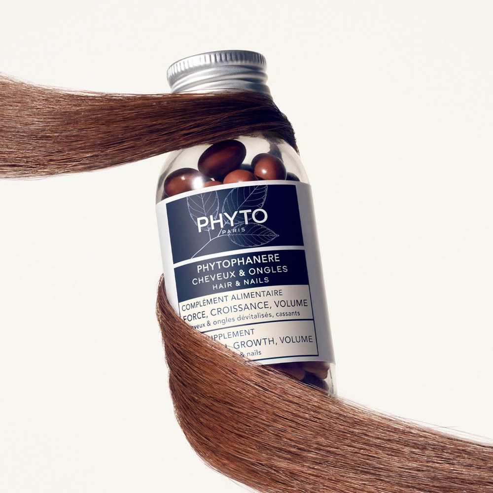 Emballage du produit. Boîte bleue et blanche avec nom du produit et flacon de gélules.