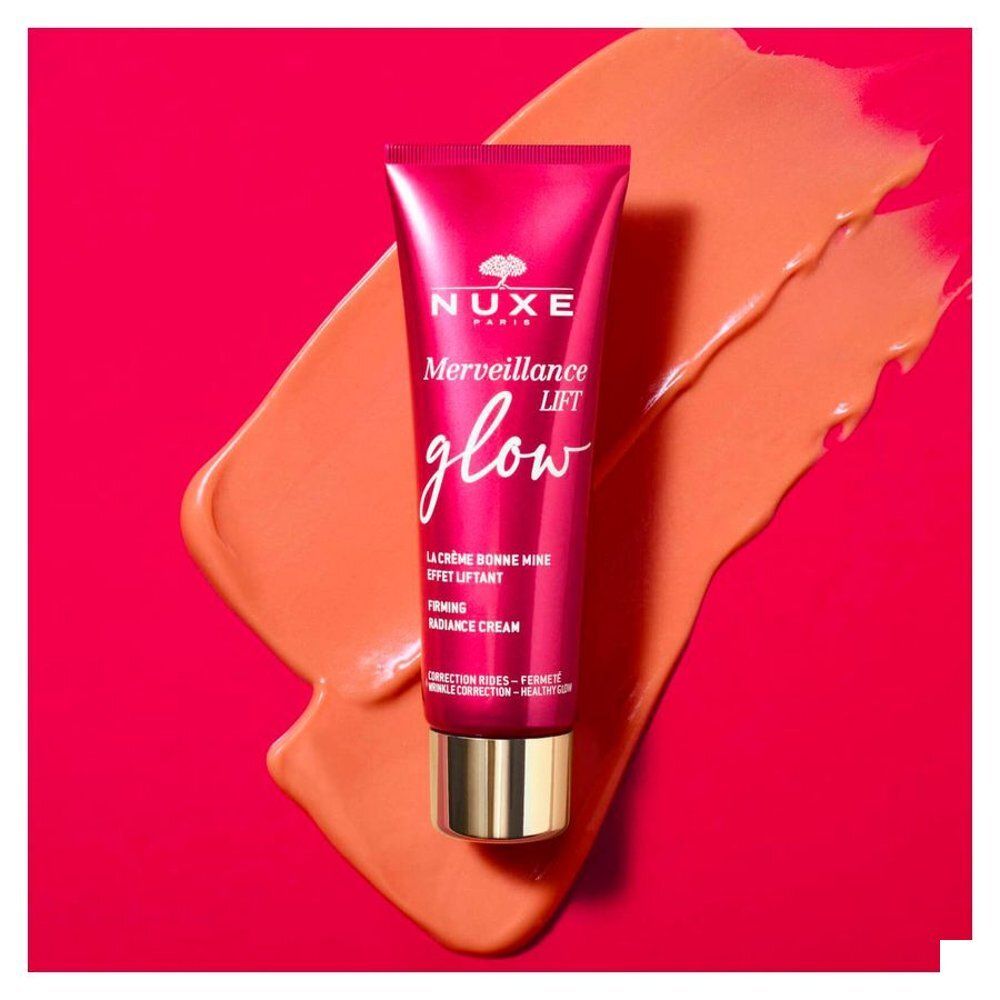 Boîte et tube de crème Nuxe Merveillance Lift Glow, rouges.