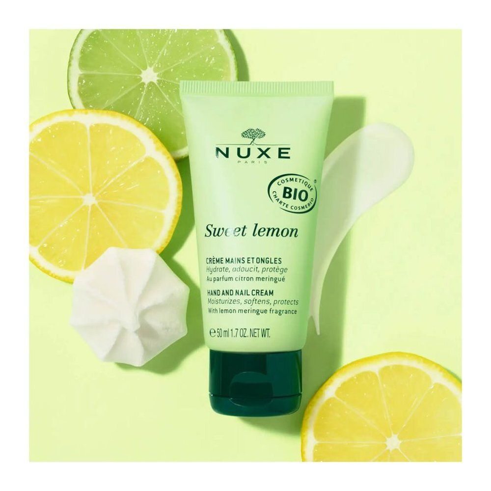 Tube Nuxe Crème Mains et Ongles Sweet Lemon avec tranches de citron et meringues.