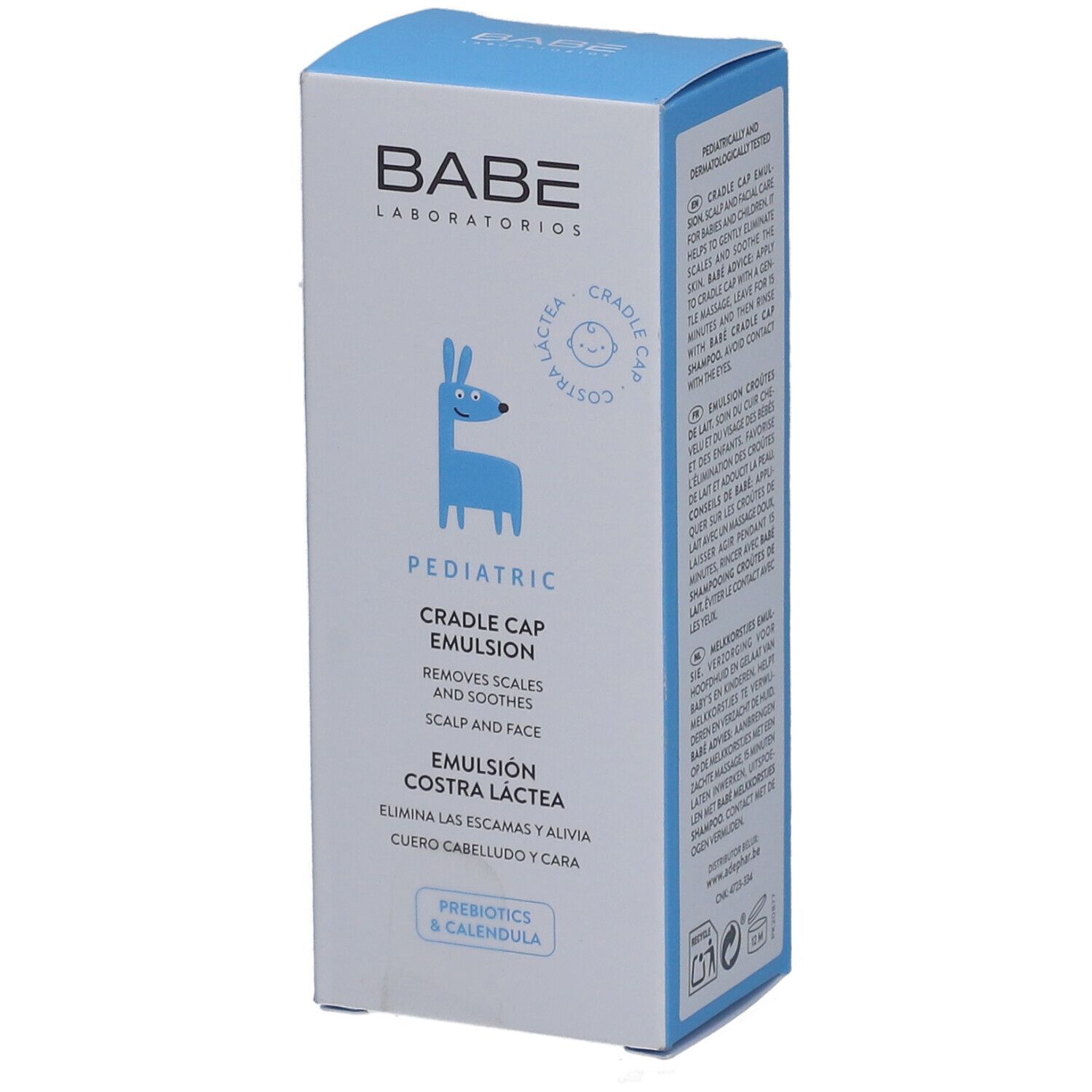 Boîte bleue avec impression. Logo BABÉ, nom du produit et illustration d'un animal bleu. Texte: Pediatric Cradle Cap Emulsion.