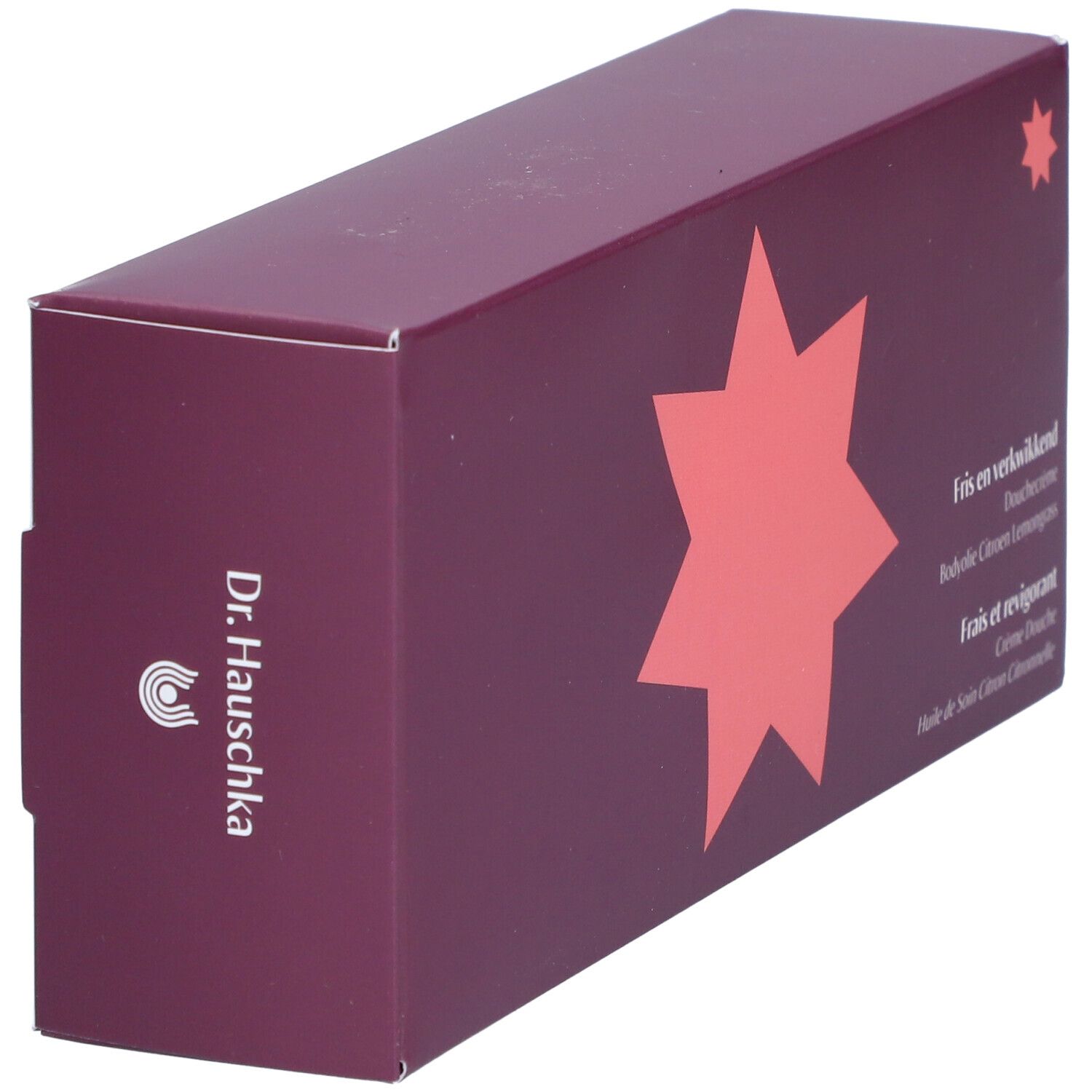 Coffret violet foncé en biais, logo en étoile. Logo Dr. Hauschka. Texte: Fris en verkwikkend, Crème Douche, Huile de Soin Citron Citronnelle.