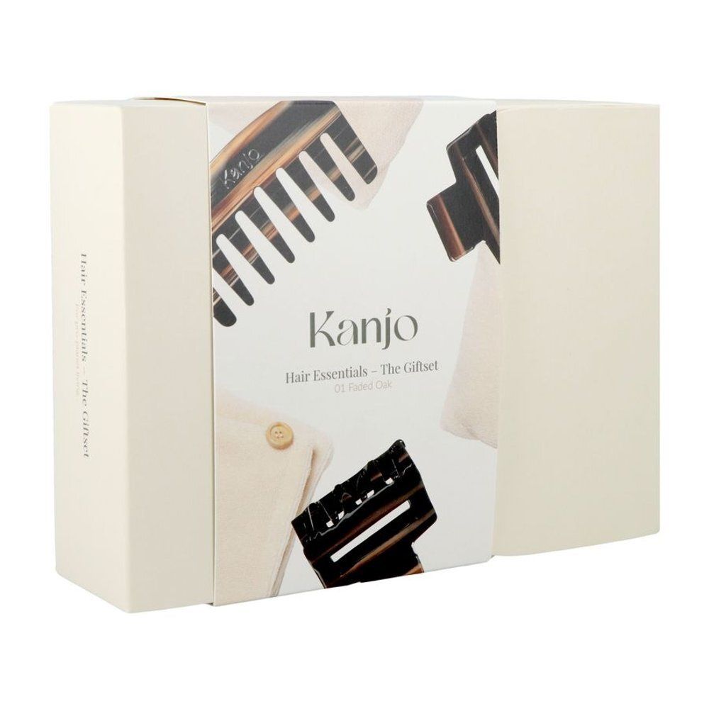 Coffret cadeau beige avec illustrations de produits. Inscription "Kanjo Hair Essentials - The Giftset". Contient des accessoires.