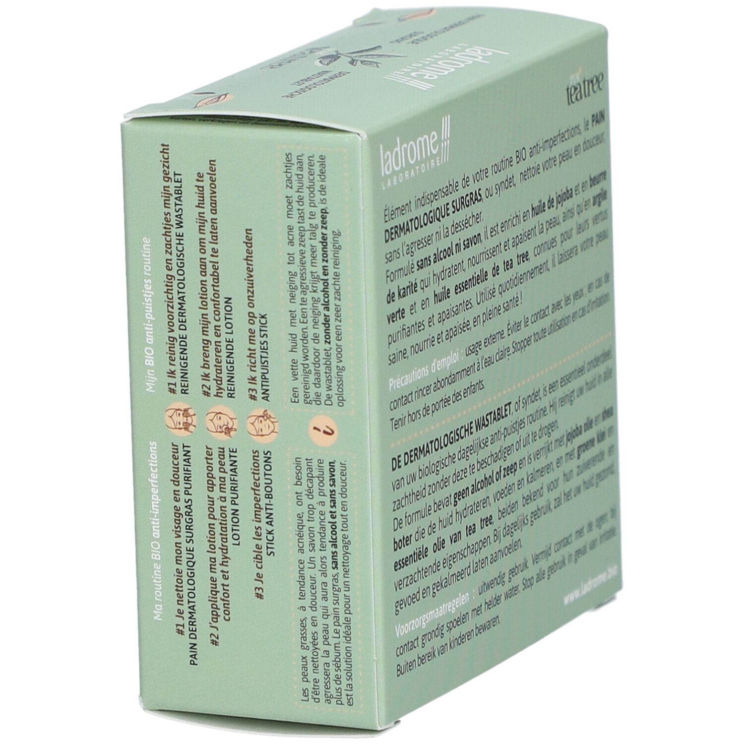 Boîte verte, nom et logo du produit. Texte : Pur Tea Tree, Pain Dermatologique surgras, Dermatologische wastablet.