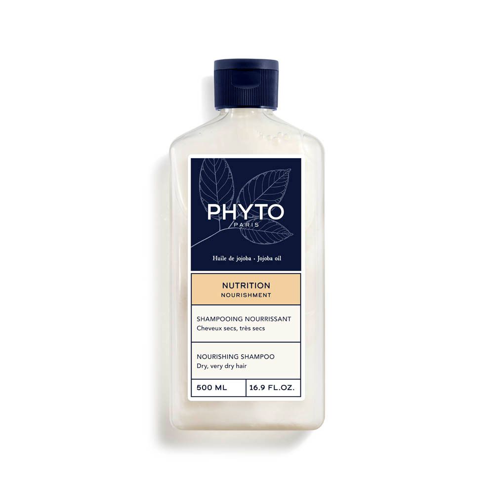Flacon de shampooing. Étiquette blanche avec logo bleu et texte. Contient de l'huile de jojoba. 500 ml. Pour cheveux secs, très secs.