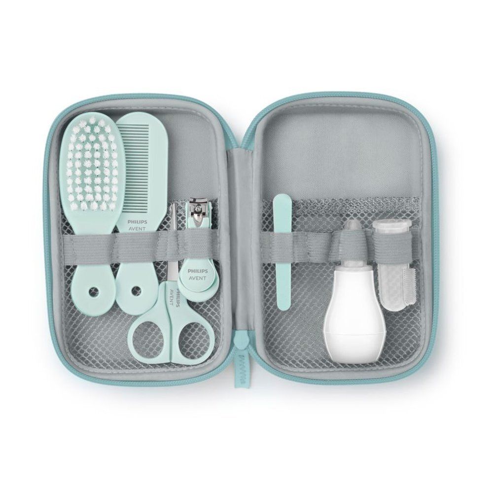 Set de soins bébé Philips Avent, ouvert. Aspirateur nasal, peigne, brosse, ciseaux, coupe-ongles.