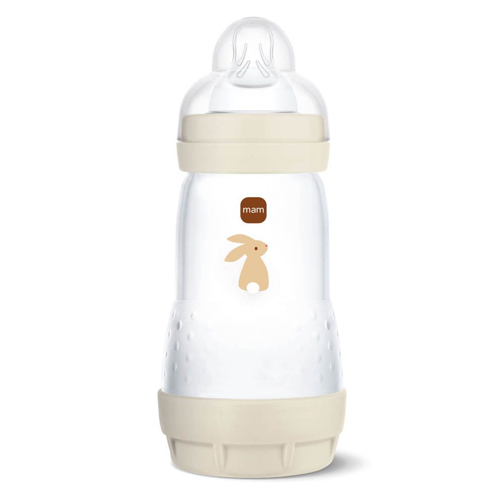 Biberon avec capuchon beige, base beige et motif de lapin.