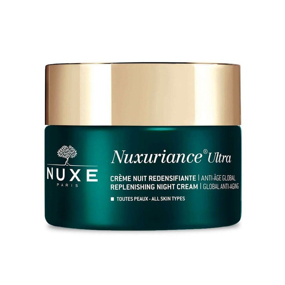 NUXE Nuxuriance Ultra crème de nuit dans un pot en verre vert avec un couvercle argenté.